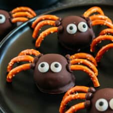 Get festive this Halloween with these tasty Chocolate Peanut Butter Spider Balls made with just 5 simple ingredients and zero baking required!  The perfect sweet and salty treats that are easy to make and your kids will love!