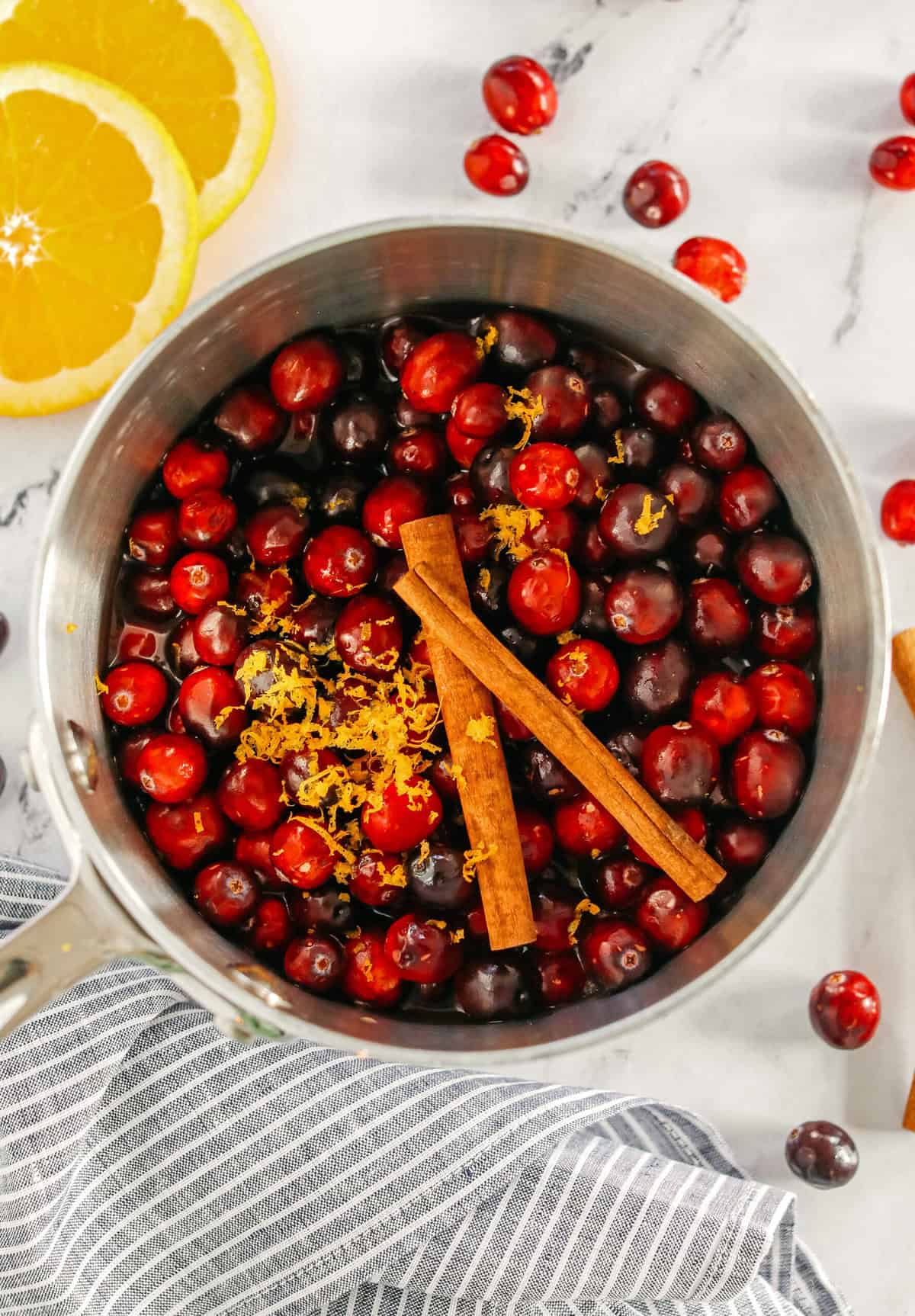 This Healthy Cranberry Sauce is naturally sweetened made with maple syrup, fresh orange juice, cinnamon, ginger and deep rich flavors from a little port wine.  Sweet, tangy and the perfect addition to your Thanksgiving and Christmas table this season!