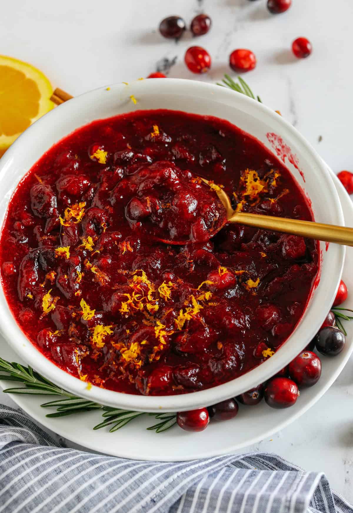 This Healthy Cranberry Sauce is naturally sweetened made with maple syrup, fresh orange juice, cinnamon, ginger and deep rich flavors from a little port wine.  Sweet, tangy and the perfect addition to your Thanksgiving and Christmas table this season!