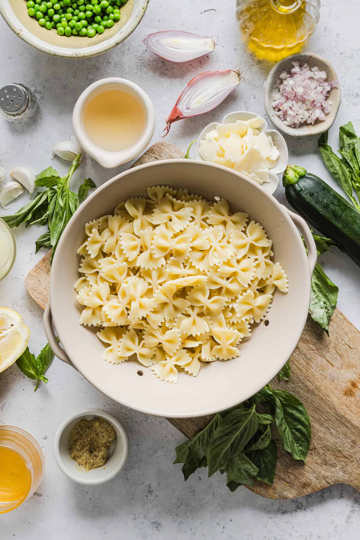 Add this light and zesty Lemon Basil Pasta Salad to your summer menu! This pasta salad is refreshing, flavorful and packed with fresh veggies. The perfect side dish to bring to your next cookout or picnic and makes a healthy weeknight dinner!