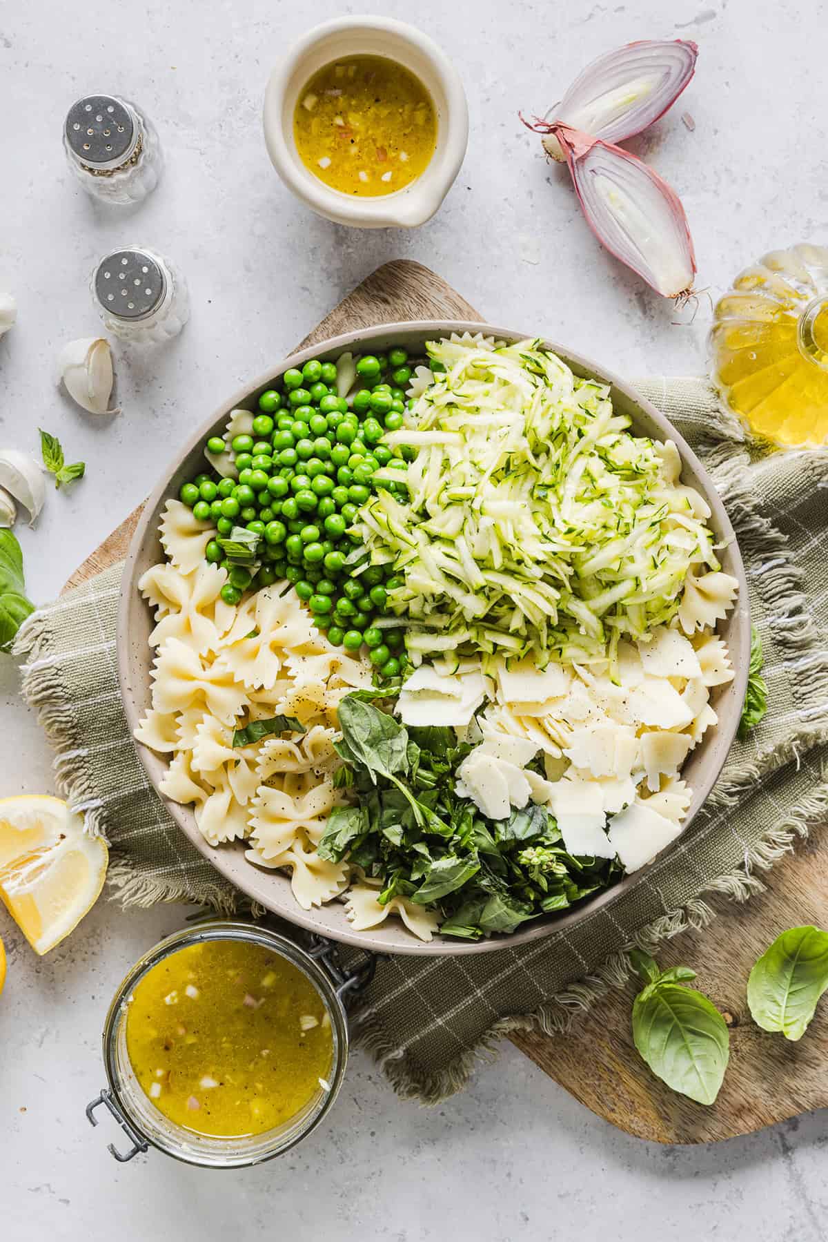 Add this light and zesty Lemon Basil Pasta Salad to your summer menu! This pasta salad is refreshing, flavorful and packed with fresh veggies. The perfect side dish to bring to your next cookout or picnic and makes a healthy weeknight dinner!