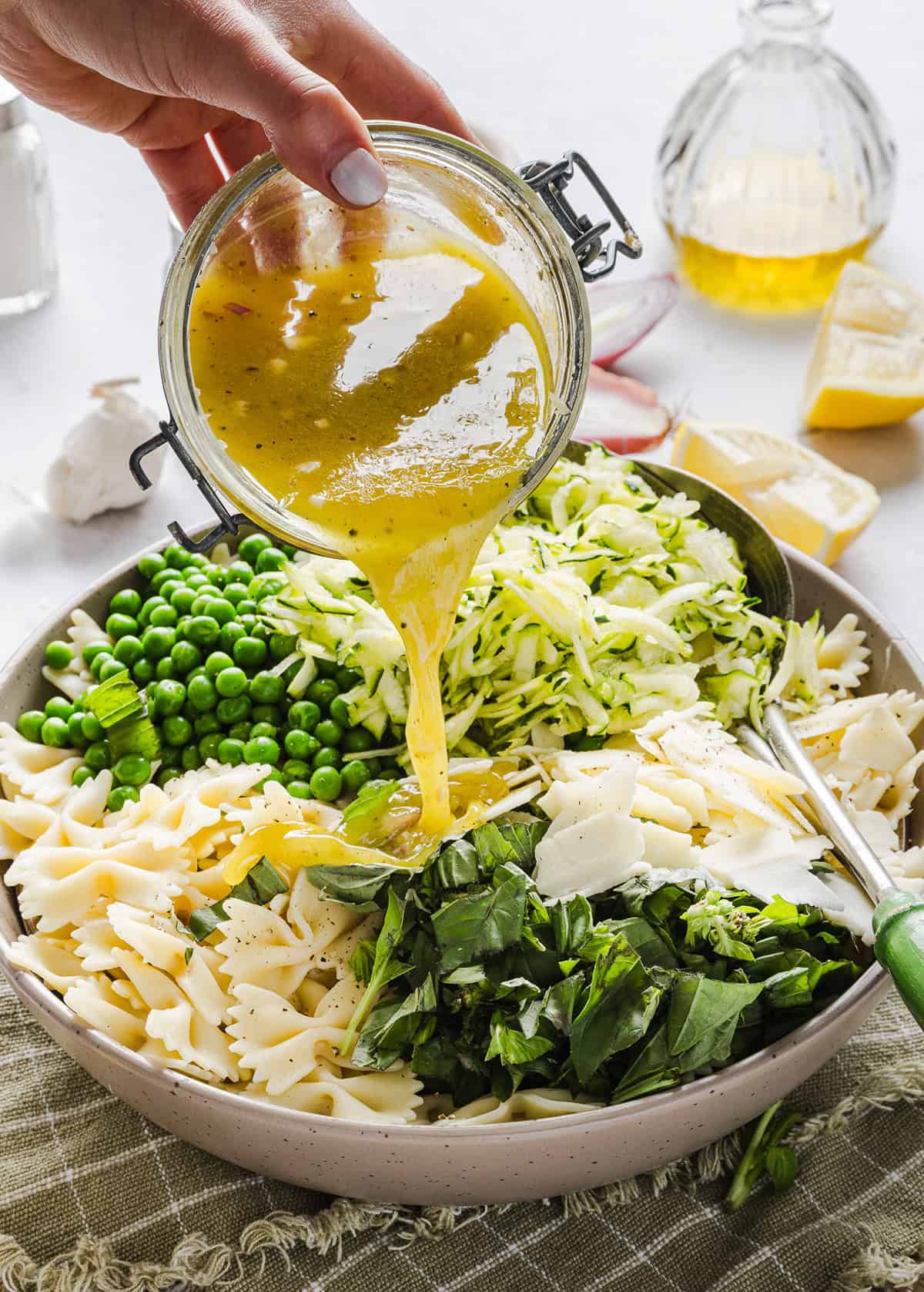 Add this light and zesty Lemon Basil Pasta Salad to your summer menu! This pasta salad is refreshing, flavorful and packed with fresh veggies. The perfect side dish to bring to your next cookout or picnic and makes a healthy weeknight dinner!