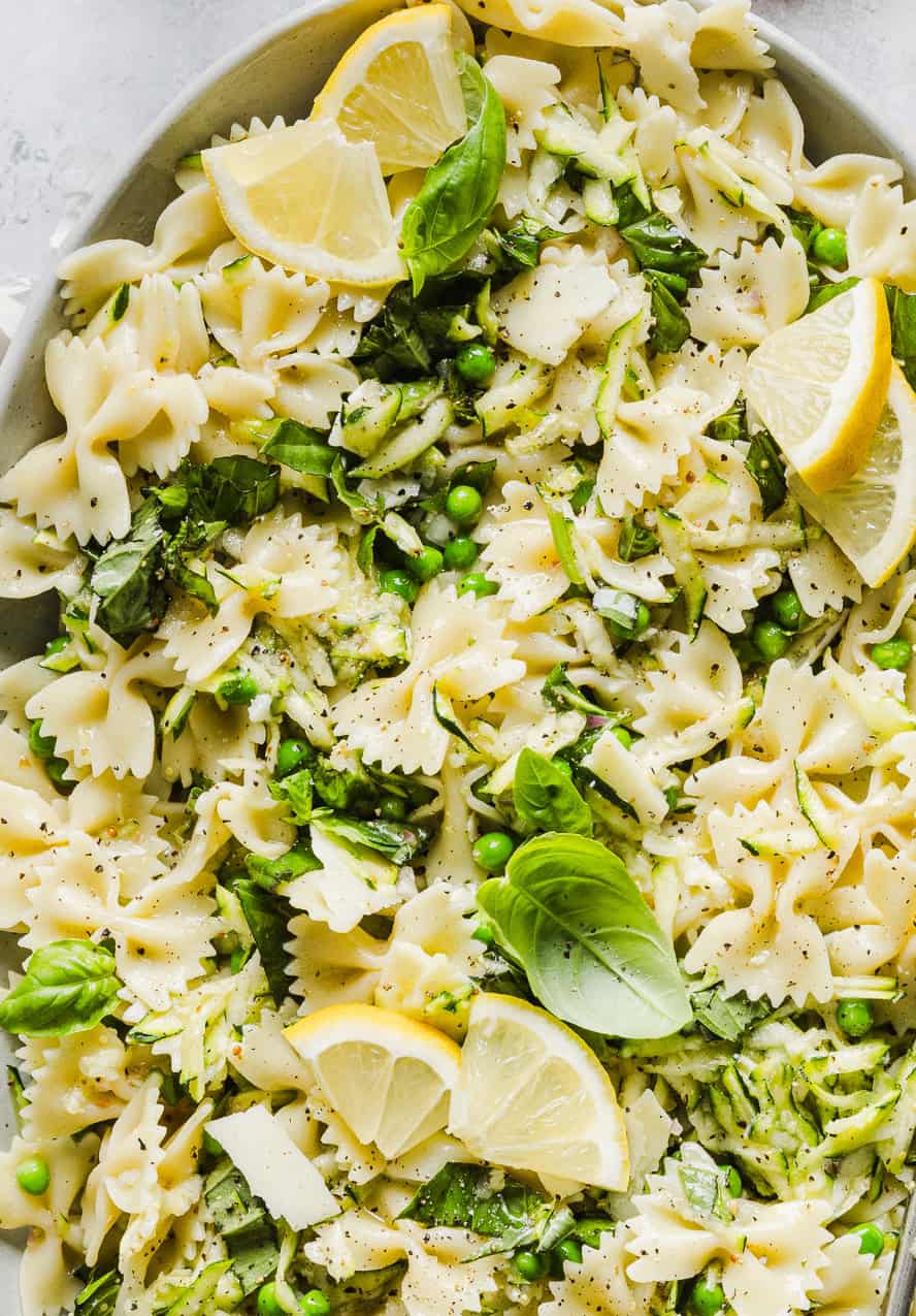 Add this light and zesty Lemon Basil Pasta Salad to your summer menu! This pasta salad is refreshing, flavorful and packed with fresh veggies. The perfect side dish to bring to your next cookout or picnic and makes a healthy weeknight dinner!