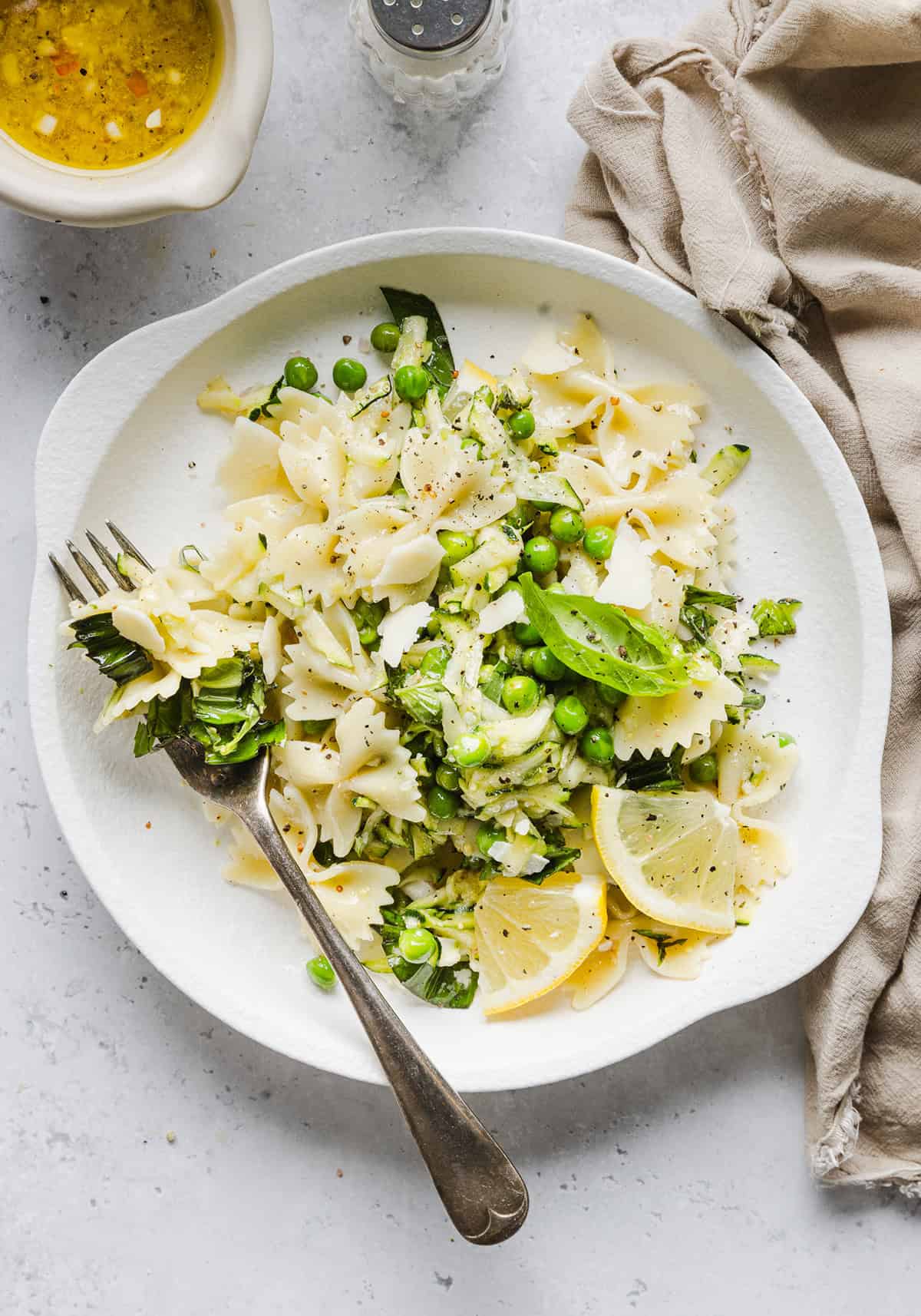 Add this light and zesty Lemon Basil Pasta Salad to your summer menu! This pasta salad is refreshing, flavorful and packed with fresh veggies. The perfect side dish to bring to your next cookout or picnic and makes a healthy weeknight dinner!