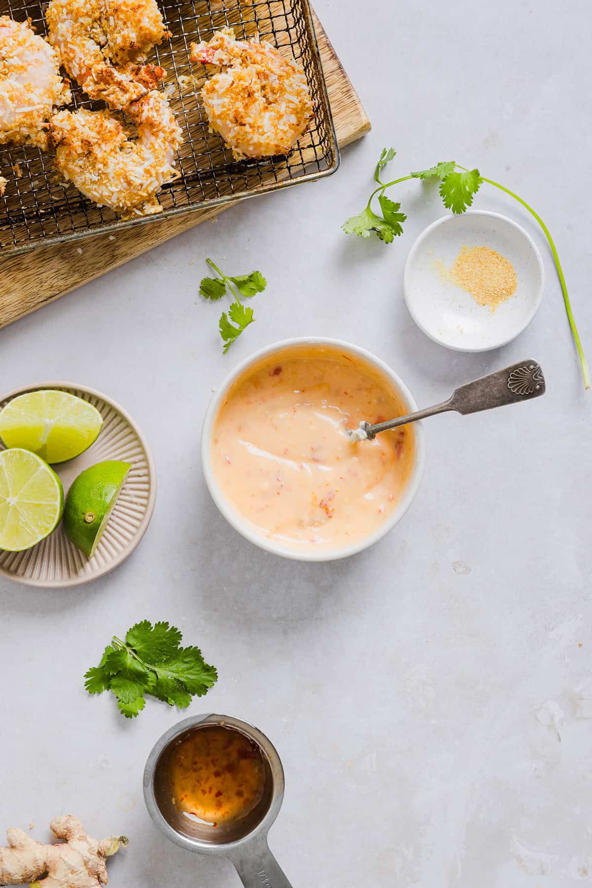 Sweet and Crispy Air Fryer Coconut Shrimp easily made in under 20 minutes and served with the most delicious chili dipping sauce! This appetizer is always a crowd-pleaser,  but also makes a filling main dish served with a salad, veggies or in a wrap.