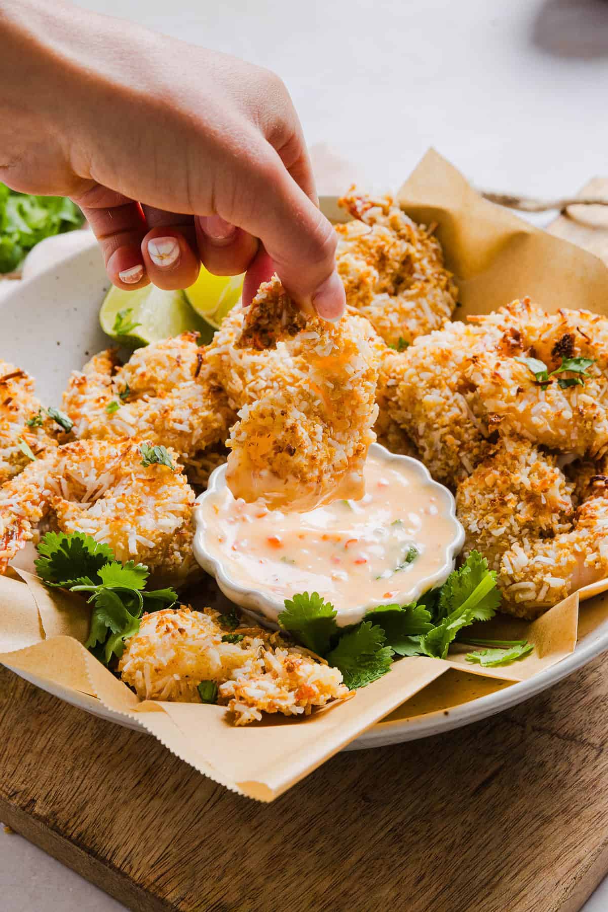 Sweet and Crispy Air Fryer Coconut Shrimp easily made in under 20 minutes and served with the most delicious chili dipping sauce! This appetizer is always a crowd-pleaser,  but also makes a filling main dish served with a salad, veggies or in a wrap.