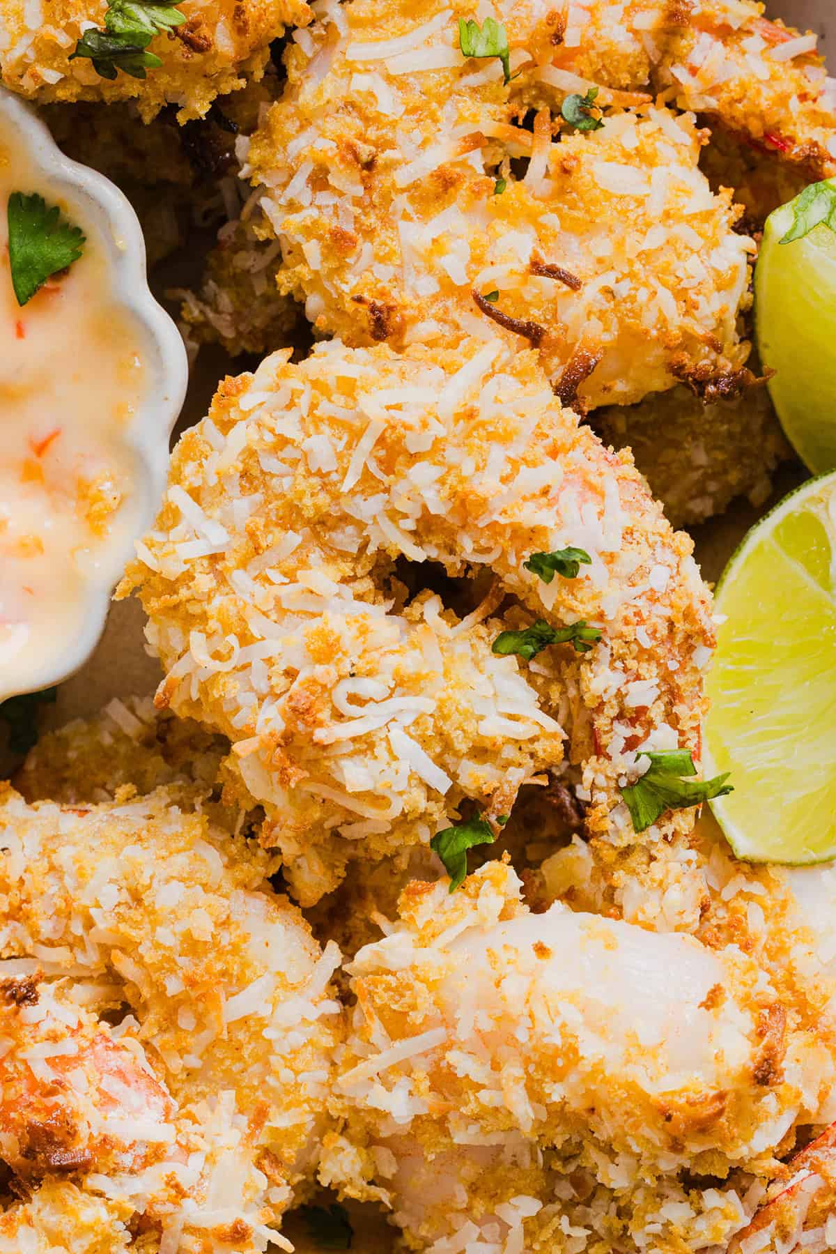 Sweet and Crispy Air Fryer Coconut Shrimp easily made in under 20 minutes and served with the most delicious chili dipping sauce! This appetizer is always a crowd-pleaser,  but also makes a filling main dish served with a salad, veggies or in a wrap.