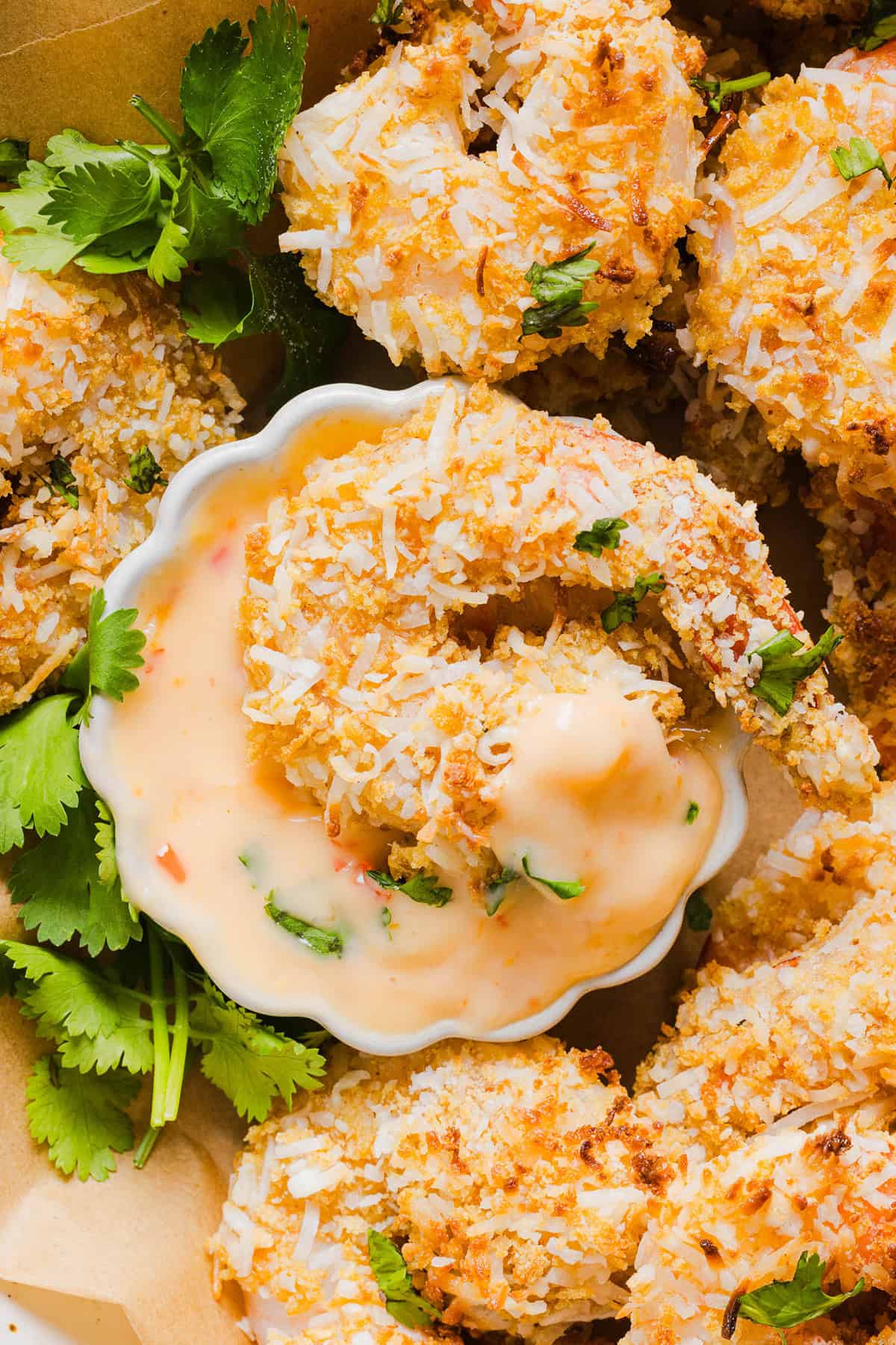 Sweet and Crispy Air Fryer Coconut Shrimp easily made in under 20 minutes and served with the most delicious chili dipping sauce! This appetizer is always a crowd-pleaser,  but also makes a filling main dish served with a salad, veggies or in a wrap.