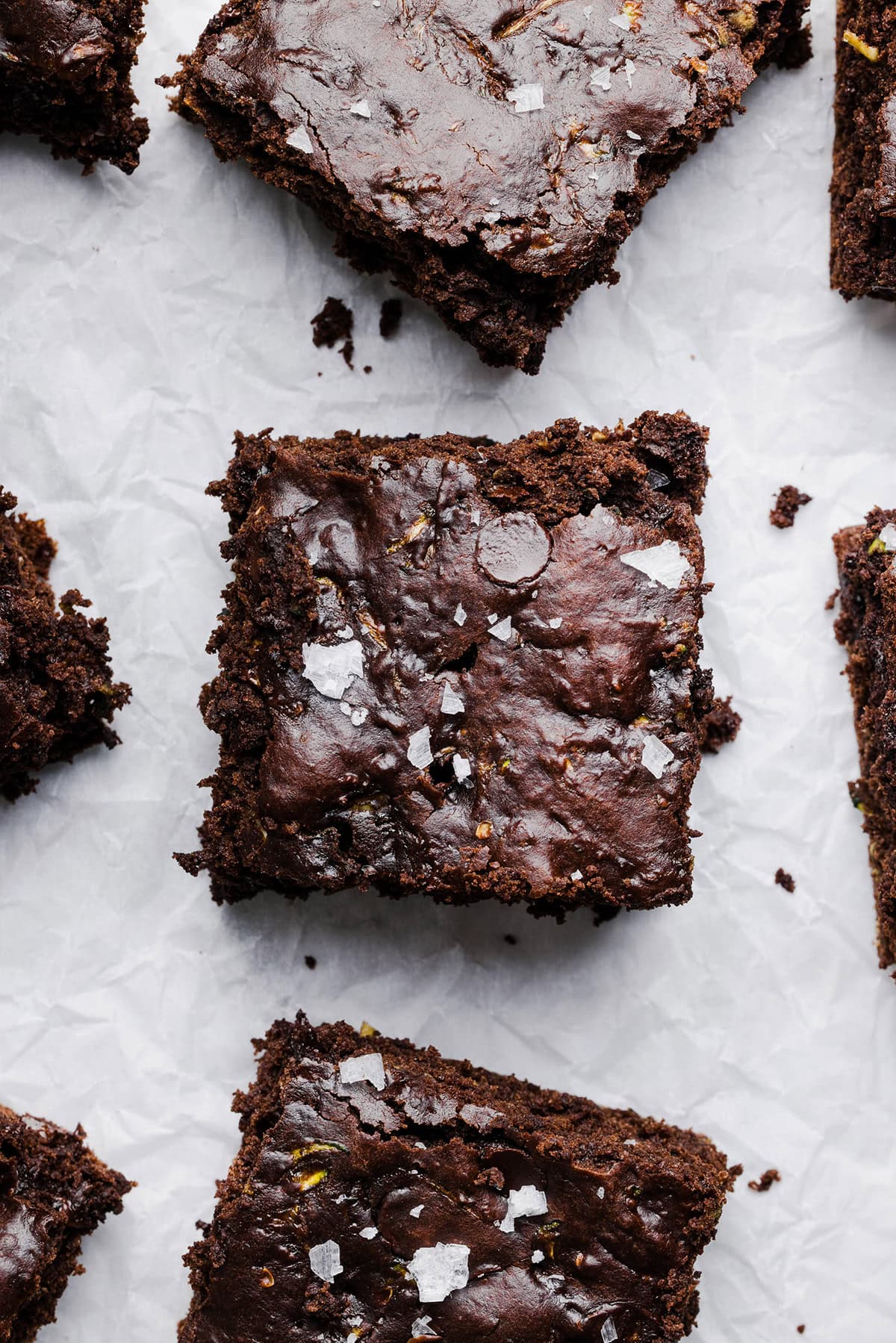 These Fudgy Zucchini Brownies are deliciously moist with a rich chocolate taste loaded with shredded zucchini and made healthier with zero butter or refined sugar!  One of our family's favorite summer desserts!