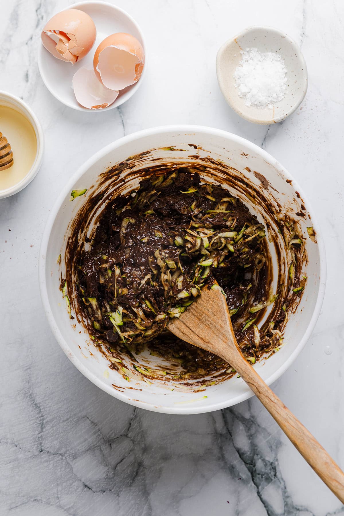 These Fudgy Zucchini Brownies are deliciously moist with a rich chocolate taste loaded with shredded zucchini and made healthier with zero butter or refined sugar!  One of our family's favorite summer desserts!