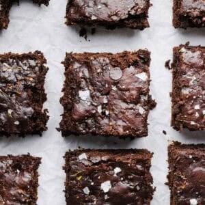These Fudgy Zucchini Brownies are deliciously moist with a rich chocolate taste loaded with shredded zucchini and made healthier with zero butter or refined sugar!  One of our family's favorite summer desserts!
