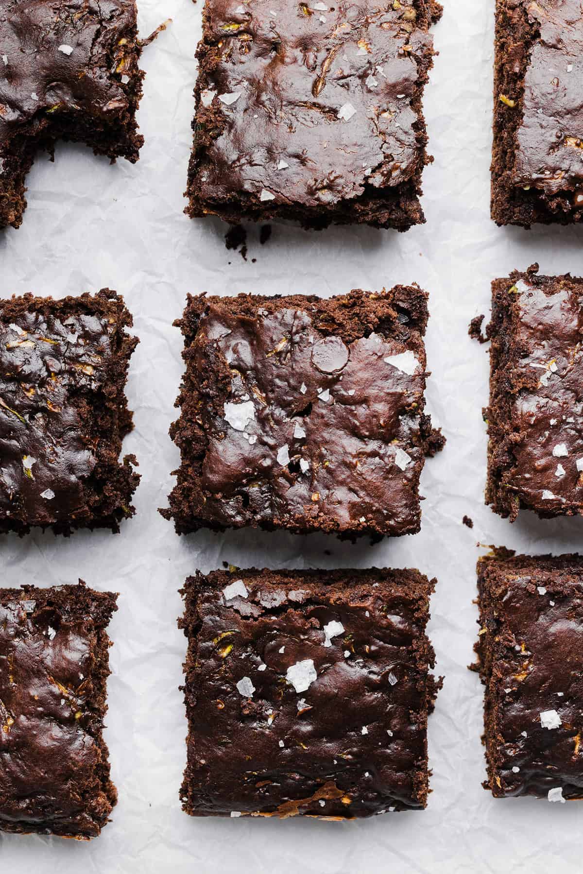 These Fudgy Zucchini Brownies are deliciously moist with a rich chocolate taste loaded with shredded zucchini and made healthier with zero butter or refined sugar!  One of our family's favorite summer desserts!