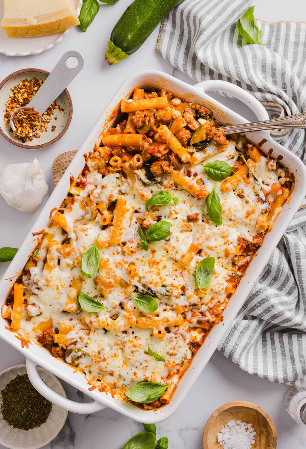 Comforting and delicious Healthy Baked Ziti packed with veggies, flavorful turkey sausage and makes the perfect weeknight meal the whole family will love!  Leftovers guaranteed!