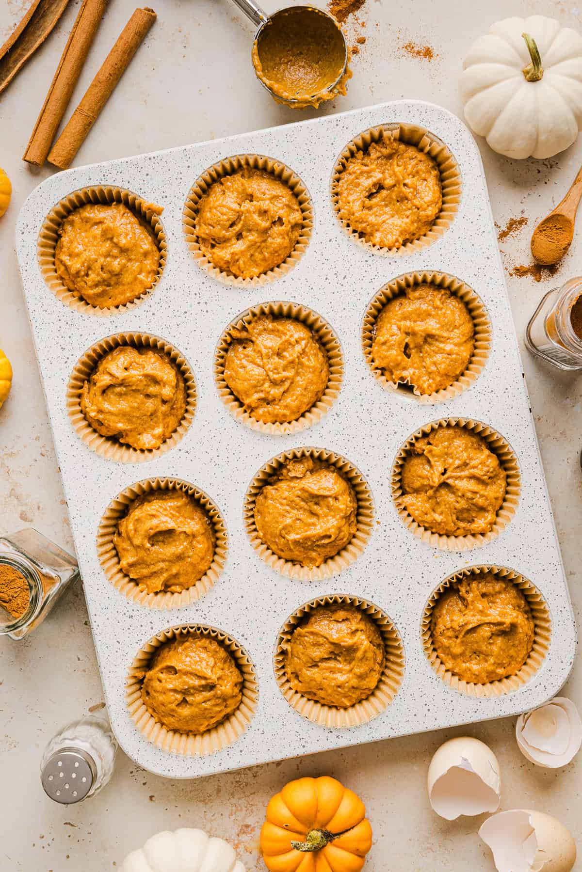 These Whole Wheat Pumpkin Muffins are moist, fluffy, and made healthier with whole wheat flour, applesauce, and zero butter or refined sugar.  Loaded with delicious pumpkin flavor and warm spices for the perfect fall muffin!