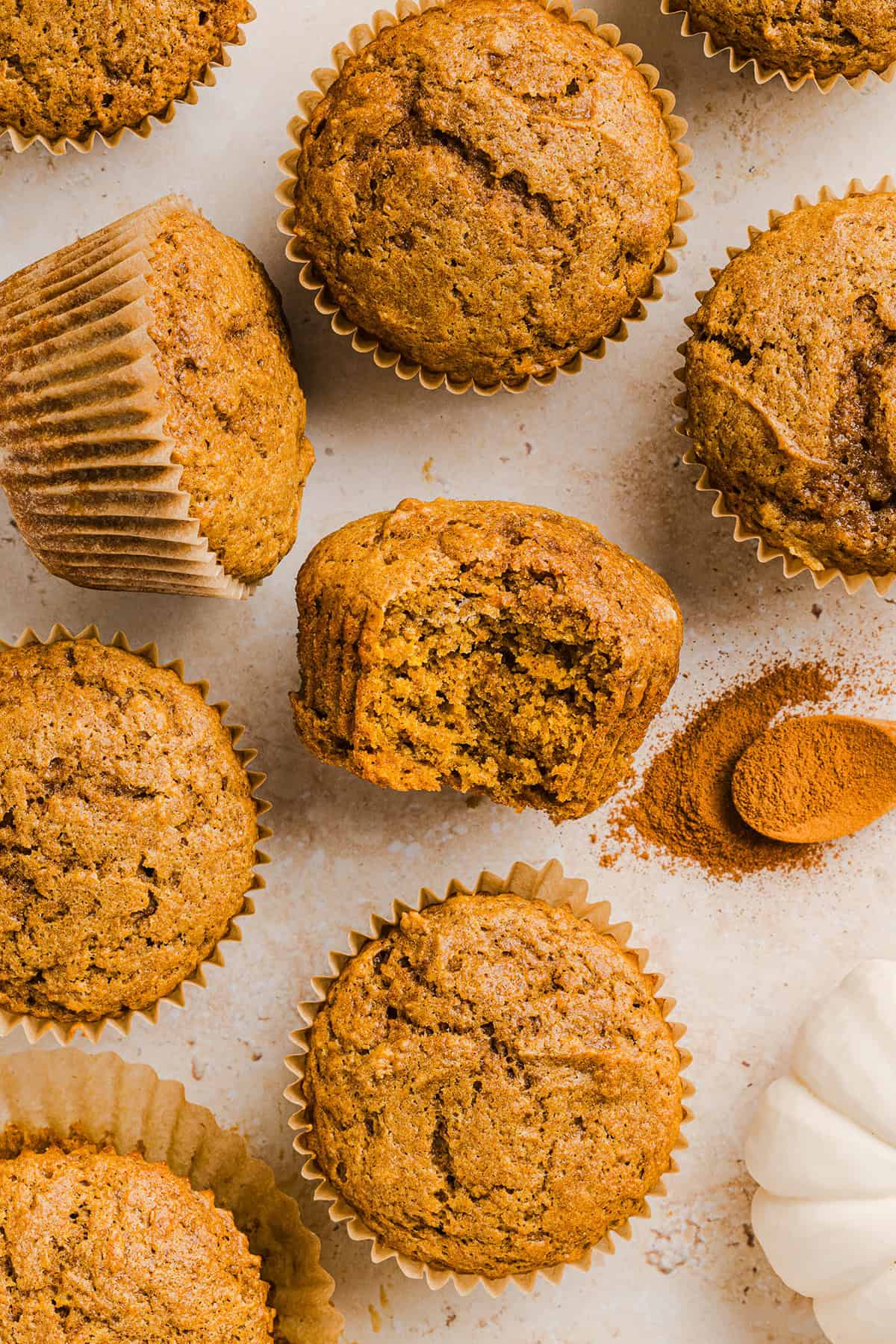 These Whole Wheat Pumpkin Muffins are moist, fluffy, and made healthier with whole wheat flour, applesauce, and zero butter or refined sugar.  Loaded with delicious pumpkin flavor and warm spices for the perfect fall muffin!