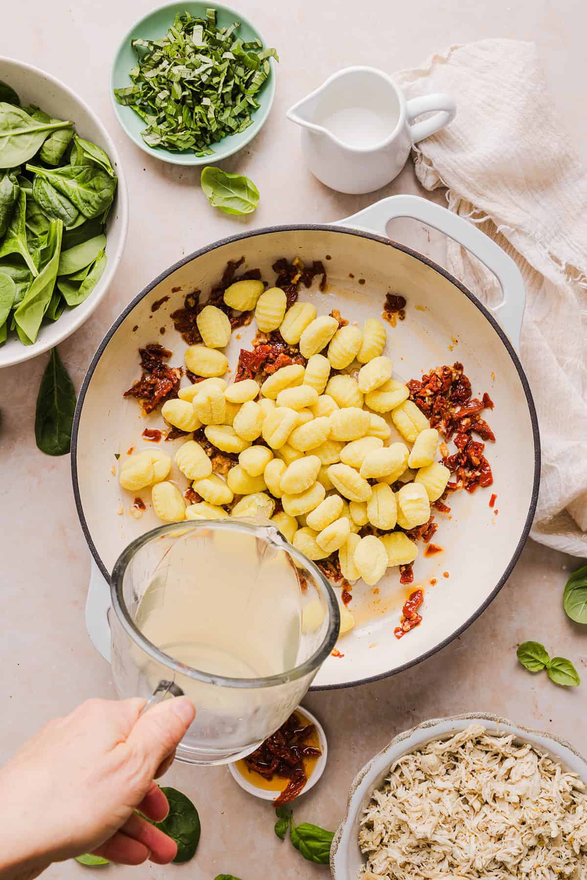 This EASY One Pan Marry Me Chicken and Gnocchi is the perfect weeknight meal! Pillowy soft gnocchi and tender chicken simmered together in a creamy sun dried tomato and parmesan sauce in just 20 minutes!