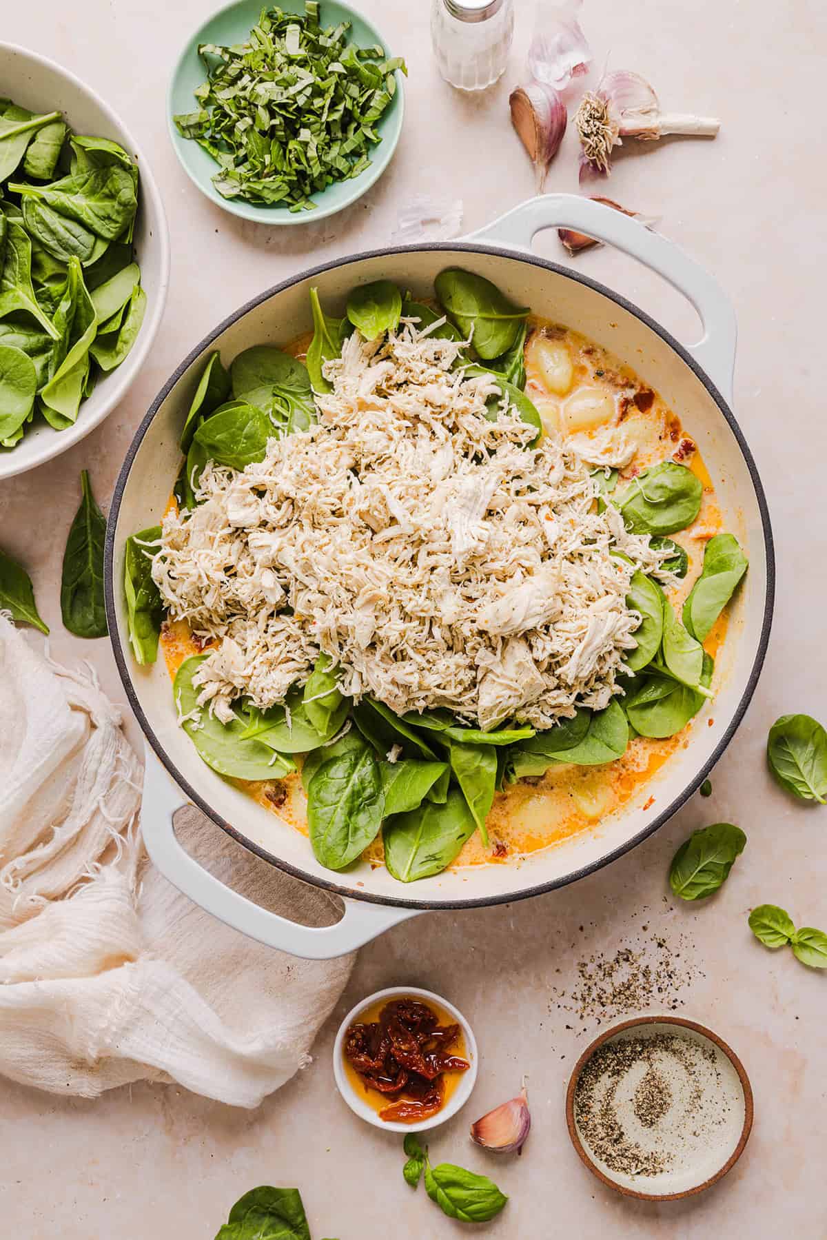 This EASY One Pan Marry Me Chicken and Gnocchi is the perfect weeknight meal! Pillowy soft gnocchi and tender chicken simmered together in a creamy sun dried tomato and parmesan sauce in just 20 minutes!