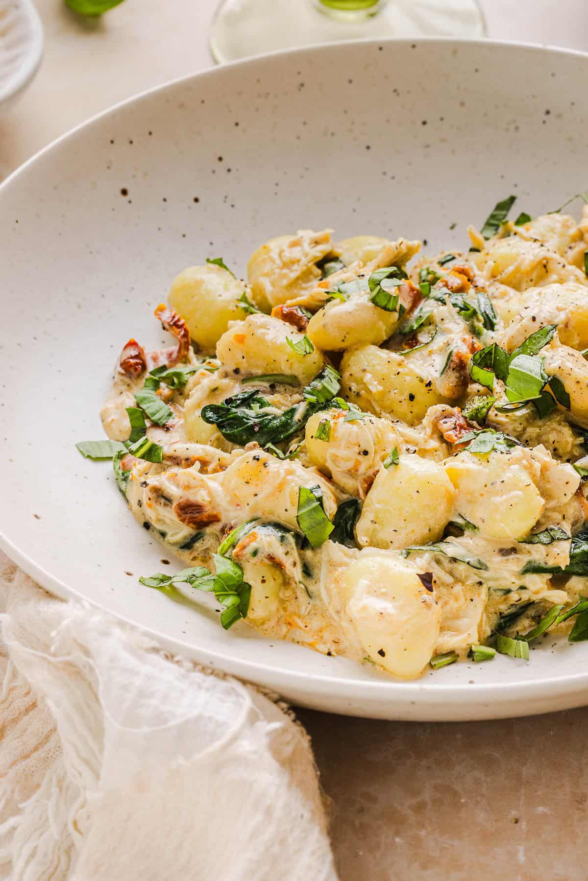 This EASY One Pan Marry Me Chicken and Gnocchi is the perfect weeknight meal! Pillowy soft gnocchi and tender chicken simmered together in a creamy sun dried tomato and parmesan sauce in just 20 minutes!