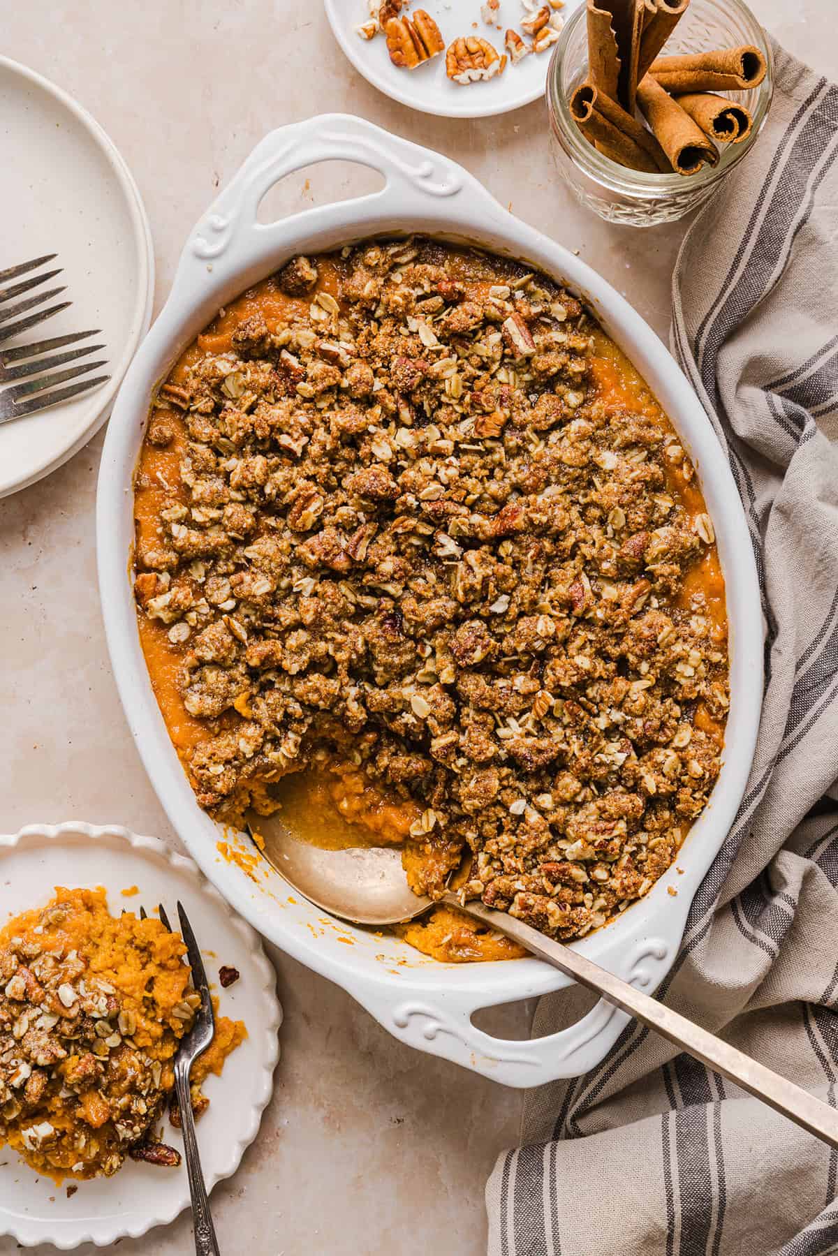 This Healthy Sweet Potato Casserole is a family favorite! A classic holiday side dish that tastes just as delicious as traditional sweet potatoes, but without any refined sugar and a wholesome pecan streusel topping!