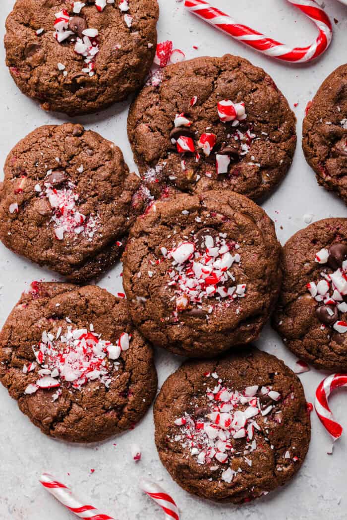 These chewy Chocolate Chip Peppermint Cookies are rich and fudgy with a festive candy cane crunch that are so easy to make! The perfect holiday cookie made healthier with less butter, whole wheat flour and zero refined sugar.