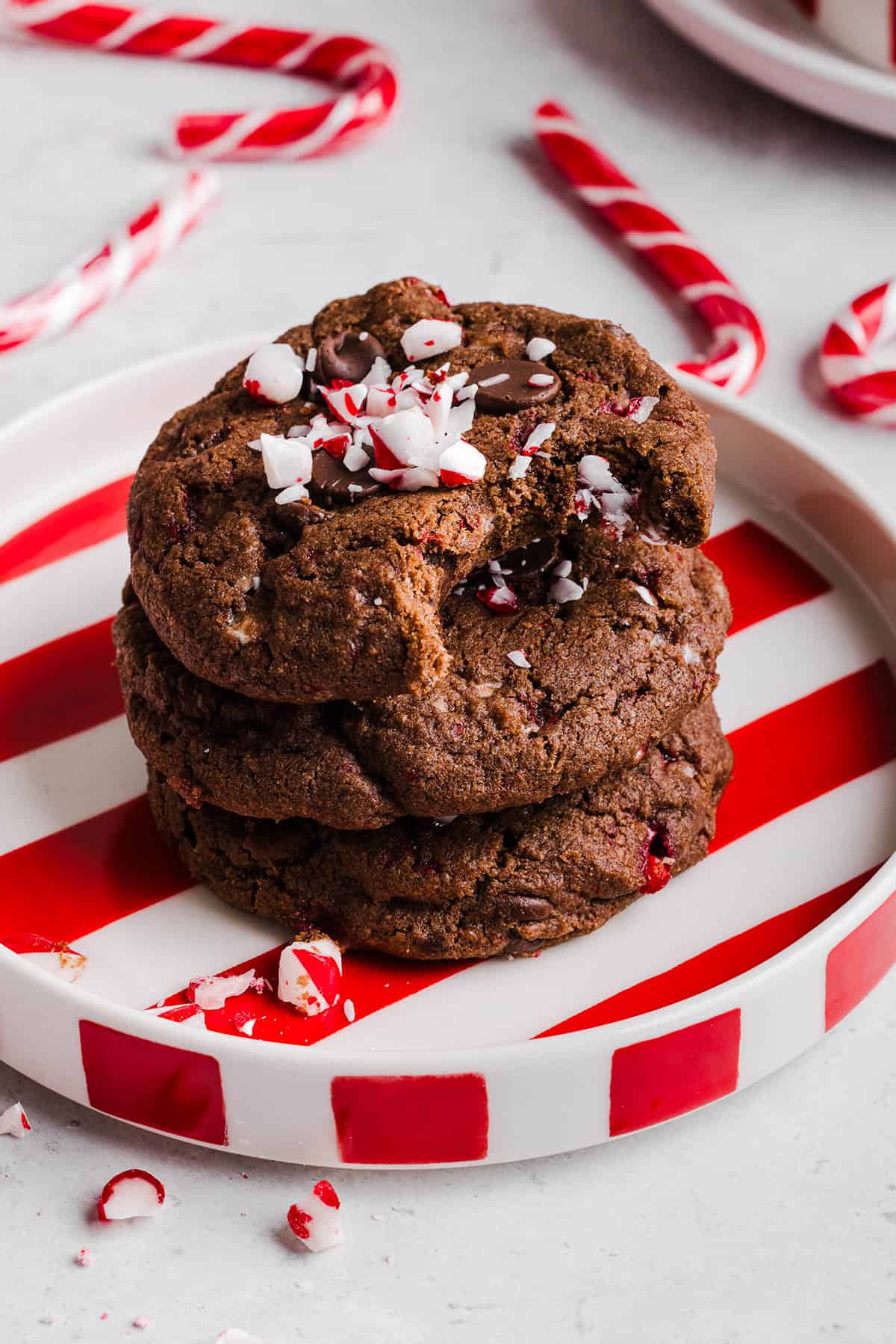 These chewy Chocolate Peppermint Cookies are rich and fudgy with a festive candy cane crunch that are so easy to make! The perfect holiday cookie made healthier with less butter, whole wheat flour and zero refined sugar.