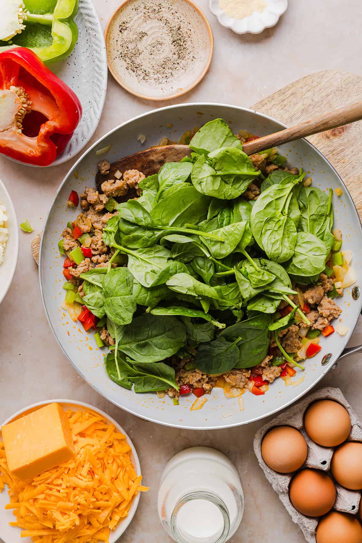 This Easy Hash Brown Breakfast Casserole is loaded with savory sausage, sautéed peppers and onions, along with melty cheese and perfectly seasoned eggs. The perfect recipe for your holiday brunch or weekend breakfast that can easily be prepped the night before!