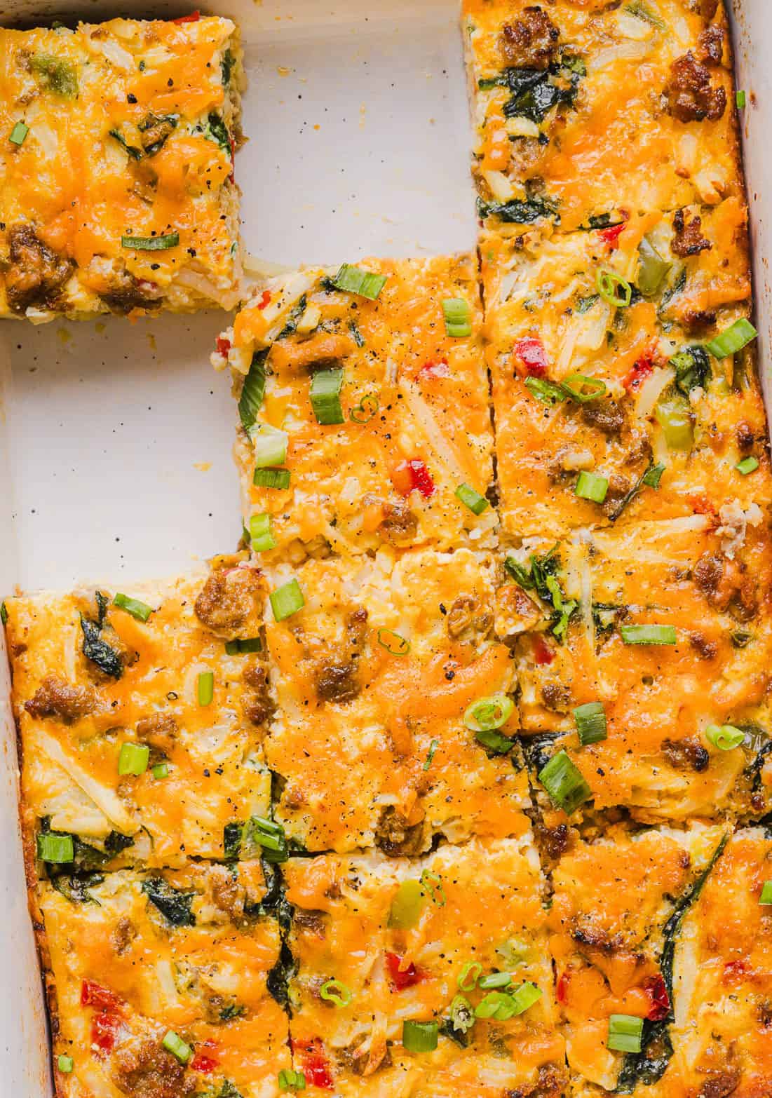 This Easy Hash Brown Breakfast Casserole is loaded with savory sausage, sautéed peppers and onions, along with melty cheese and perfectly seasoned eggs. The perfect recipe for your holiday brunch or weekend breakfast that can easily be prepped the night before!