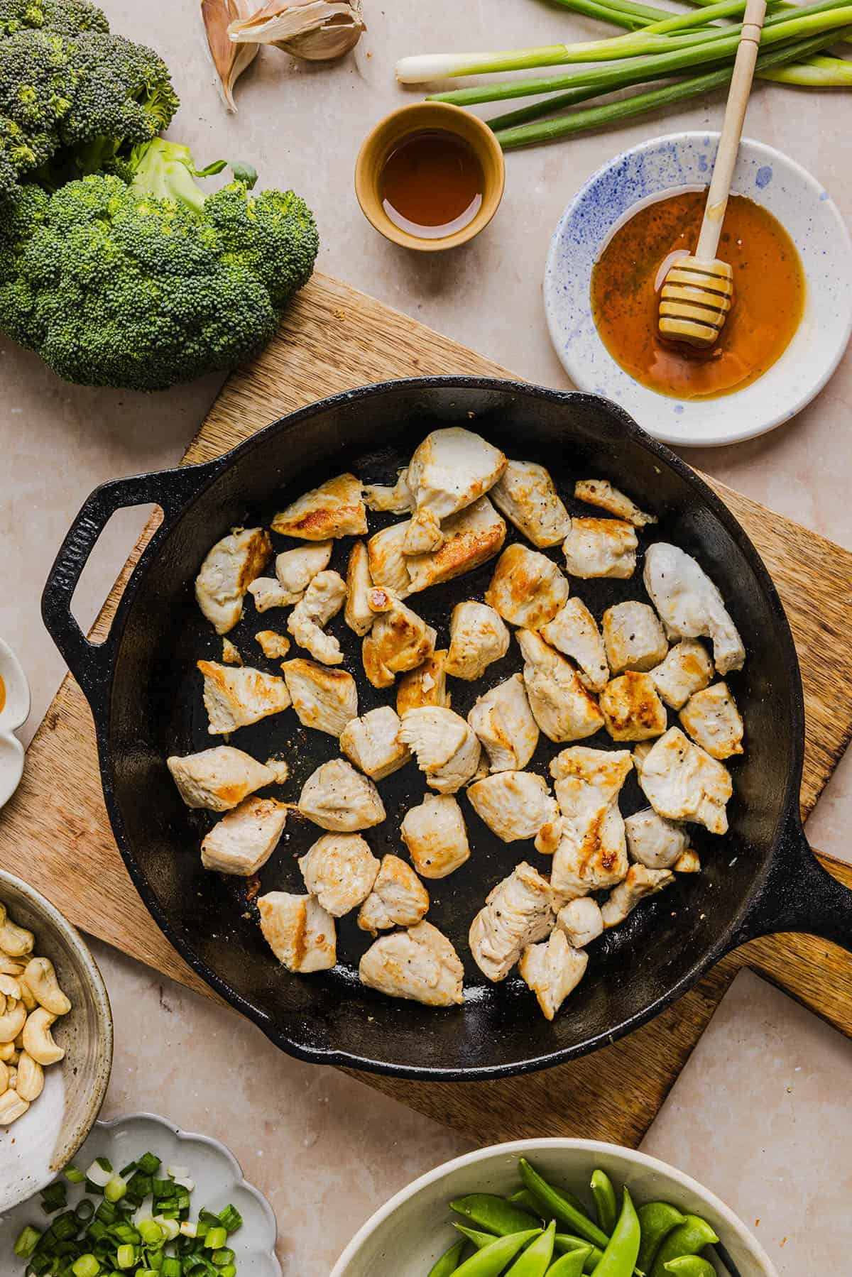 This Healthy Cashew Chicken Stir Fry is the perfect weeknight meal that is quick and easy to make, full of fresh veggies and tossed together in a delicious homemade peanut sauce!