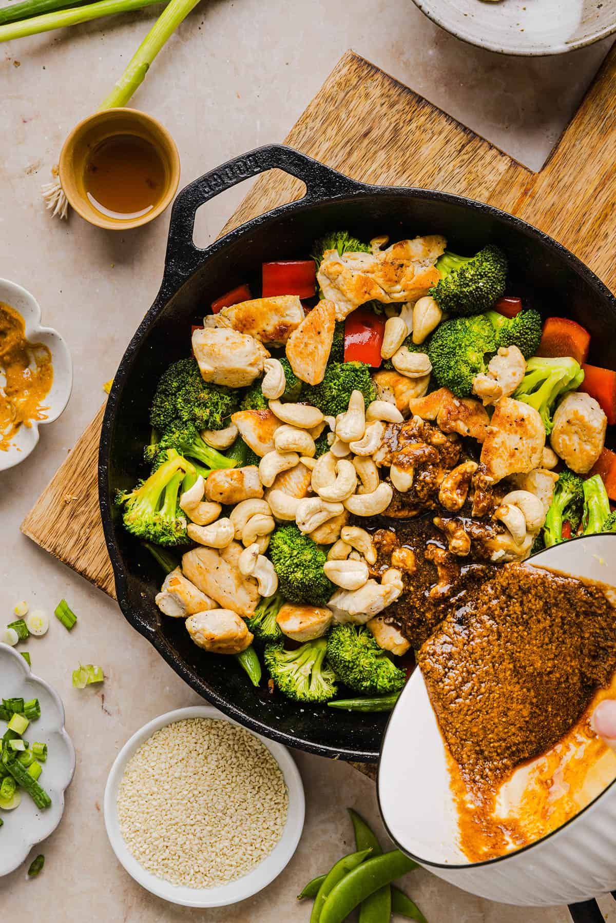 This Healthy Cashew Chicken Stir Fry is the perfect weeknight meal that is quick and easy to make, full of fresh veggies and tossed together in a delicious homemade peanut sauce!