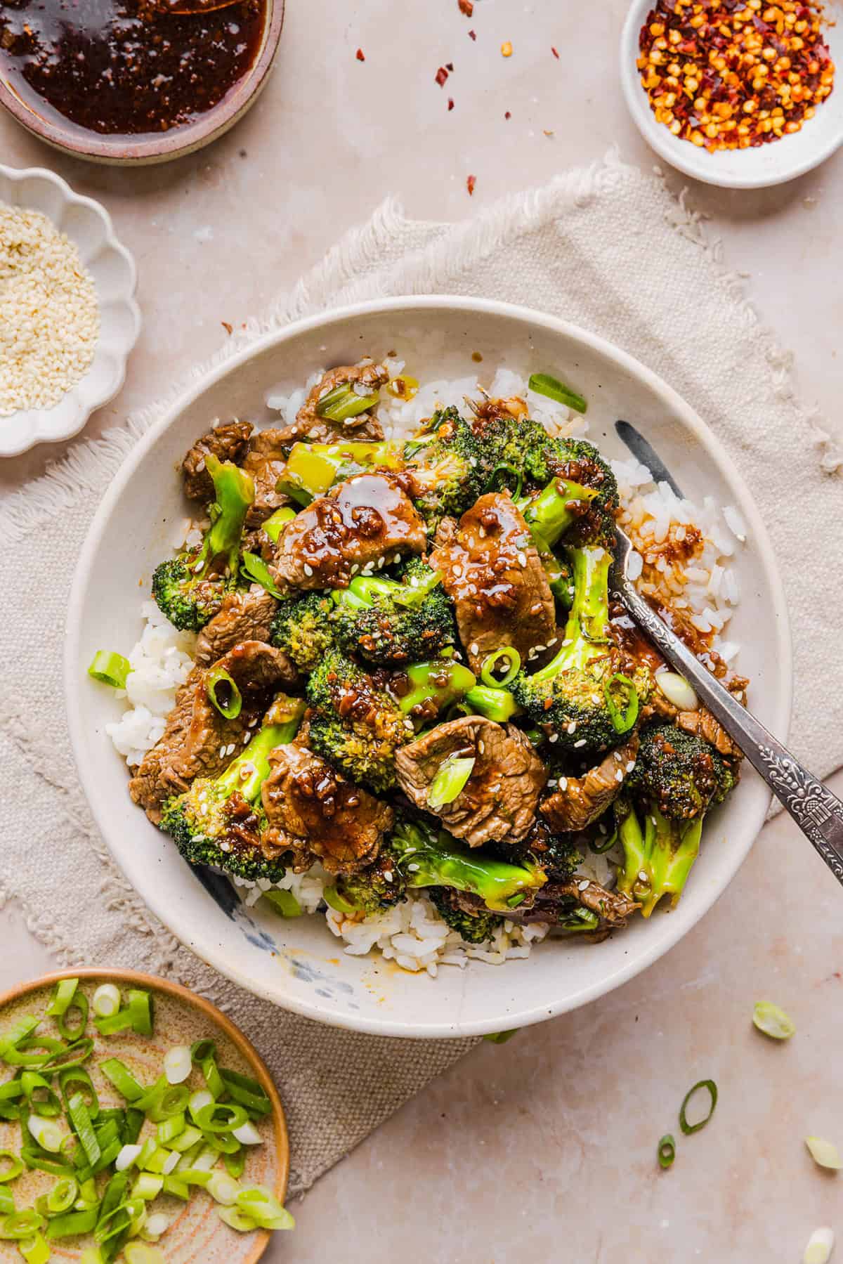 You'll love this Healthy Beef and Broccoli recipe made with tender flank steak, crisp broccoli and a savory garlic ginger sauce.  A quick and easy weeknight dinner that tastes better than take-out and comes together in under 30 minutes!