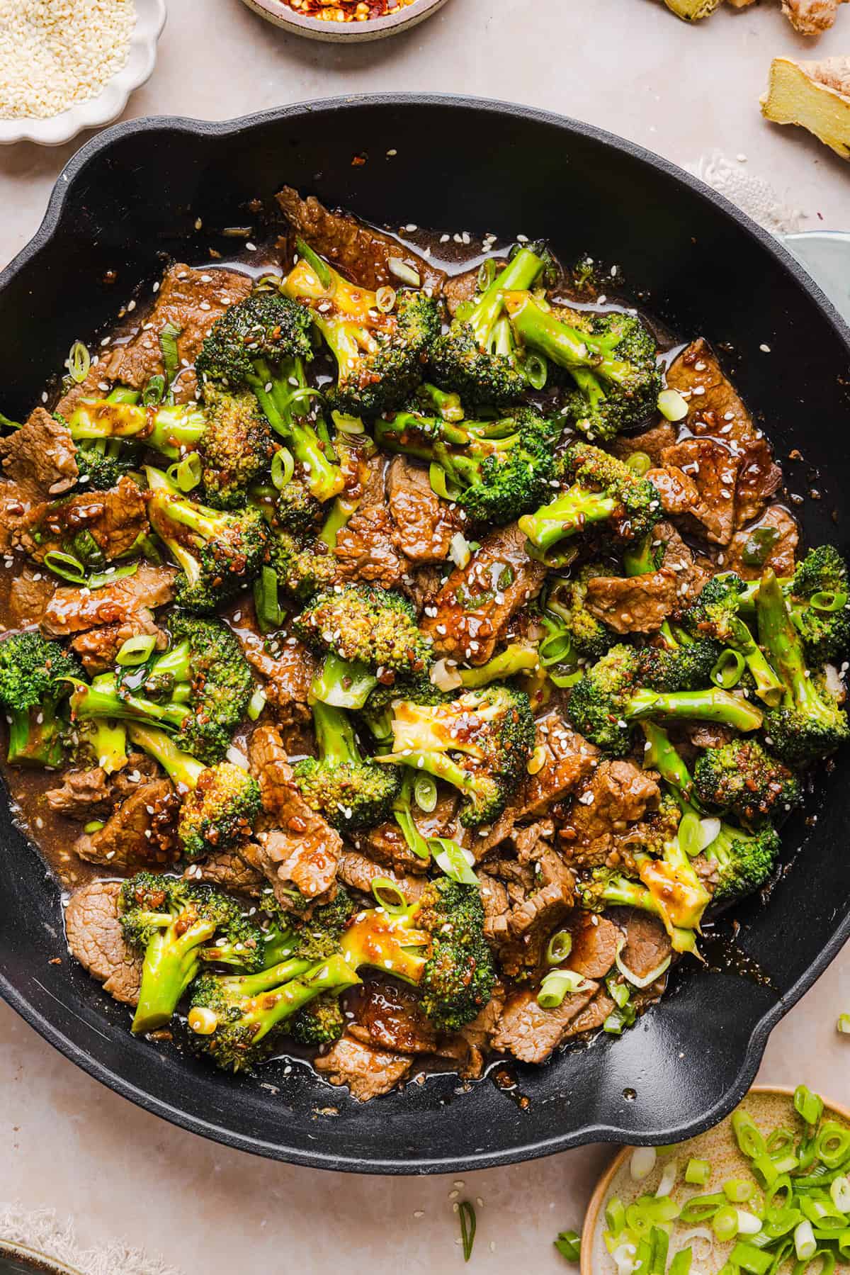 You'll love this Healthy Beef and Broccoli recipe made with tender flank steak, crisp broccoli and a savory garlic ginger sauce.  A quick and easy weeknight dinner that tastes better than take-out and comes together in under 30 minutes!