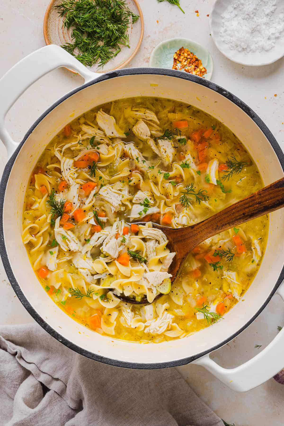 Enjoy a cozy bowl of this Easy Chicken Noodle Soup made with simple ingredients that pack in the flavor! Made with tender chicken, hearty vegetables and a rich, flavorful broth that is comforting and nourishing.