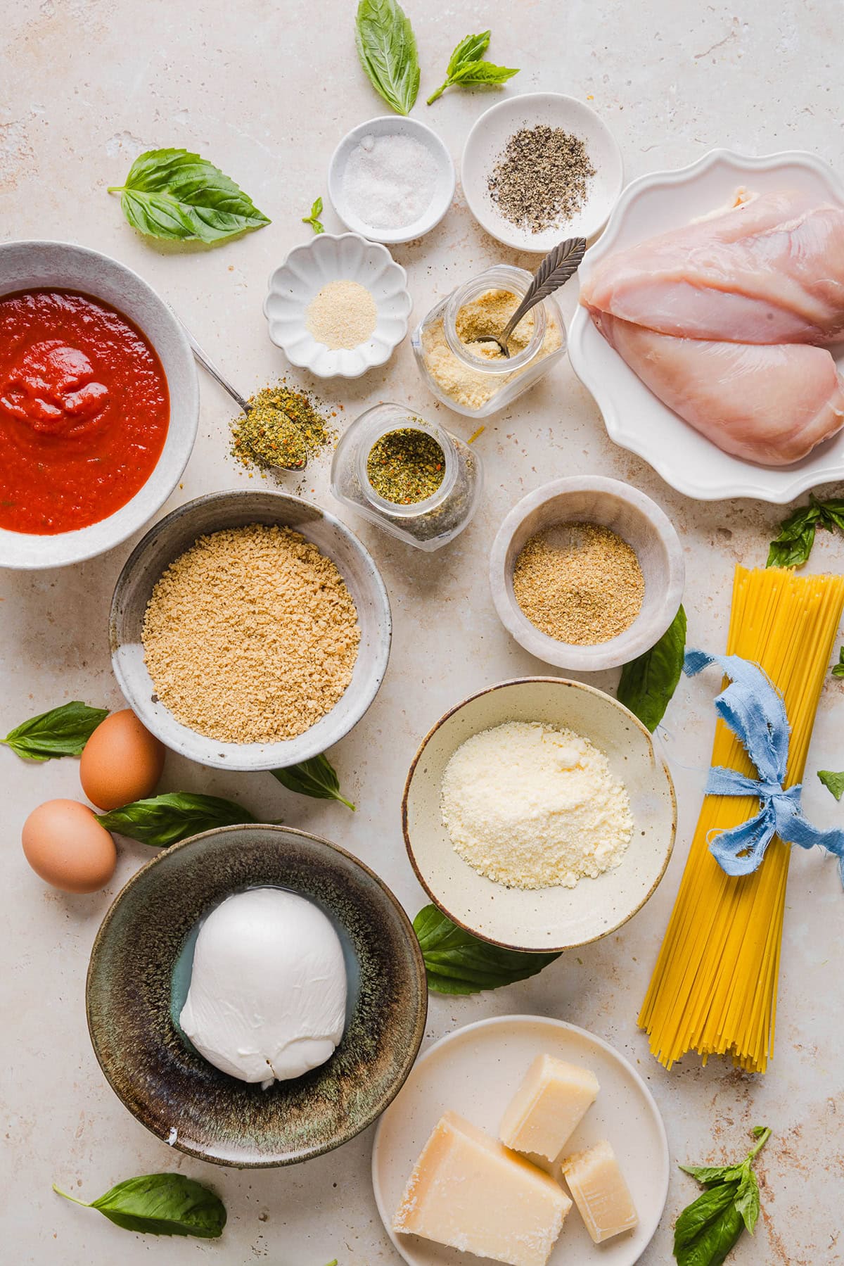 Easy Baked Chicken Parmesan made with tender juicy chicken, rich marinara sauce and melty cheese with a crisp coating that tastes delicious! This chicken is baked, not fried, and easily comes together in under 30 minutes!