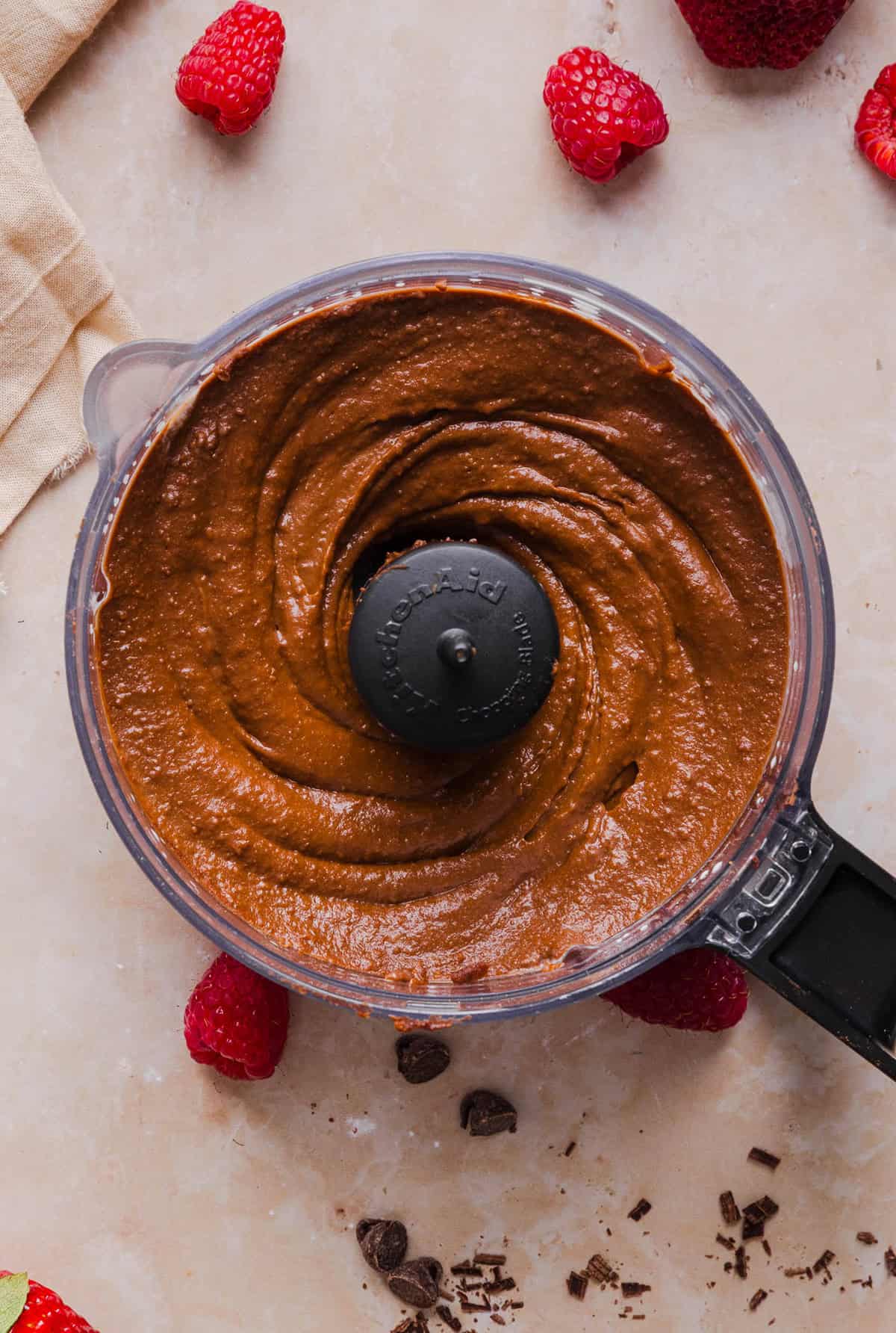 This Healthy Chocolate Hummus is rich and indulgent to satisfy your sweet tooth, but made with wholesome ingredients that you can feel good about eating! Serve with your favorite fruit, pretzels or graham crackers for the perfect fun dessert or snack!