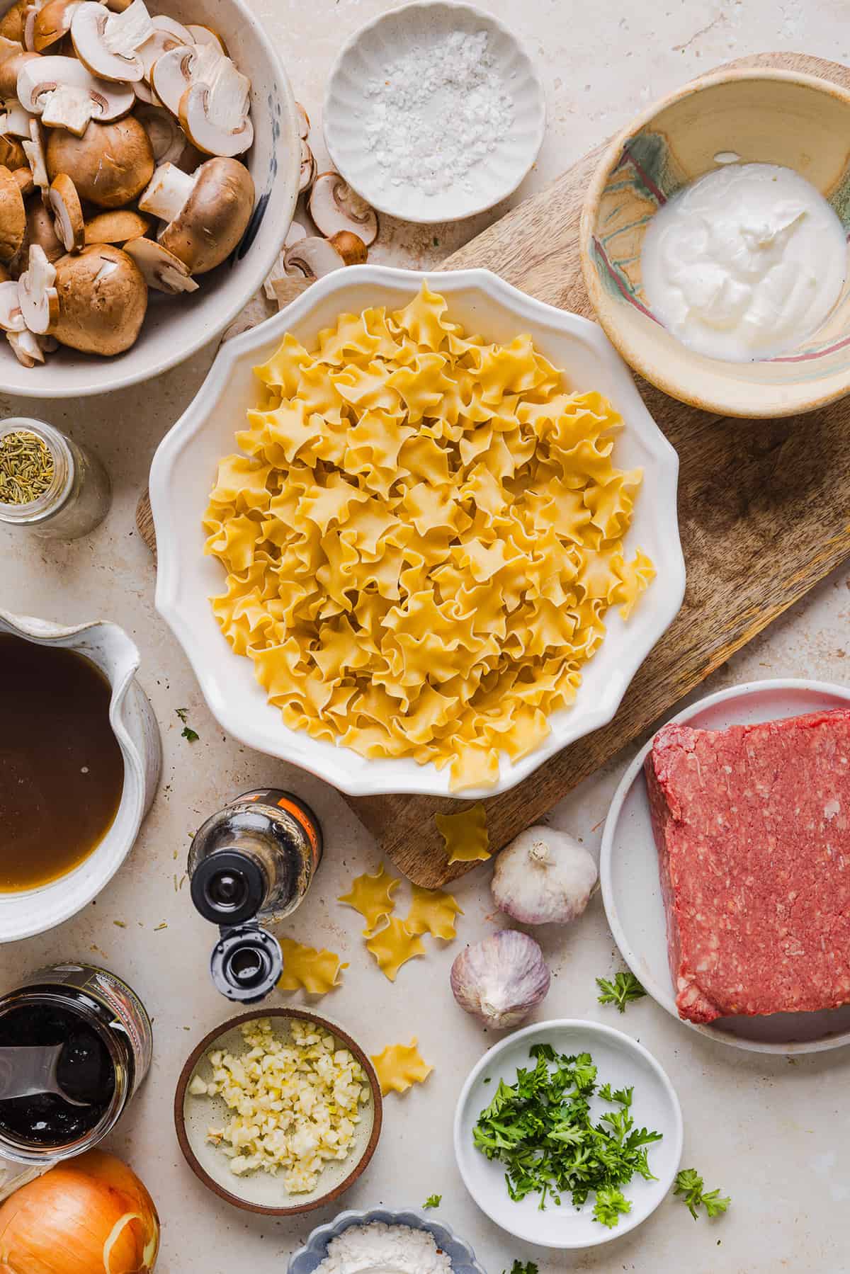 This Healthy Ground Beef Stroganoff Casserole is the ultimate family-friendly comfort food! The perfect cozy weeknight meal made with egg noodles and smothered in the most delicious creamy mushroom sauce in just 30 minutes!