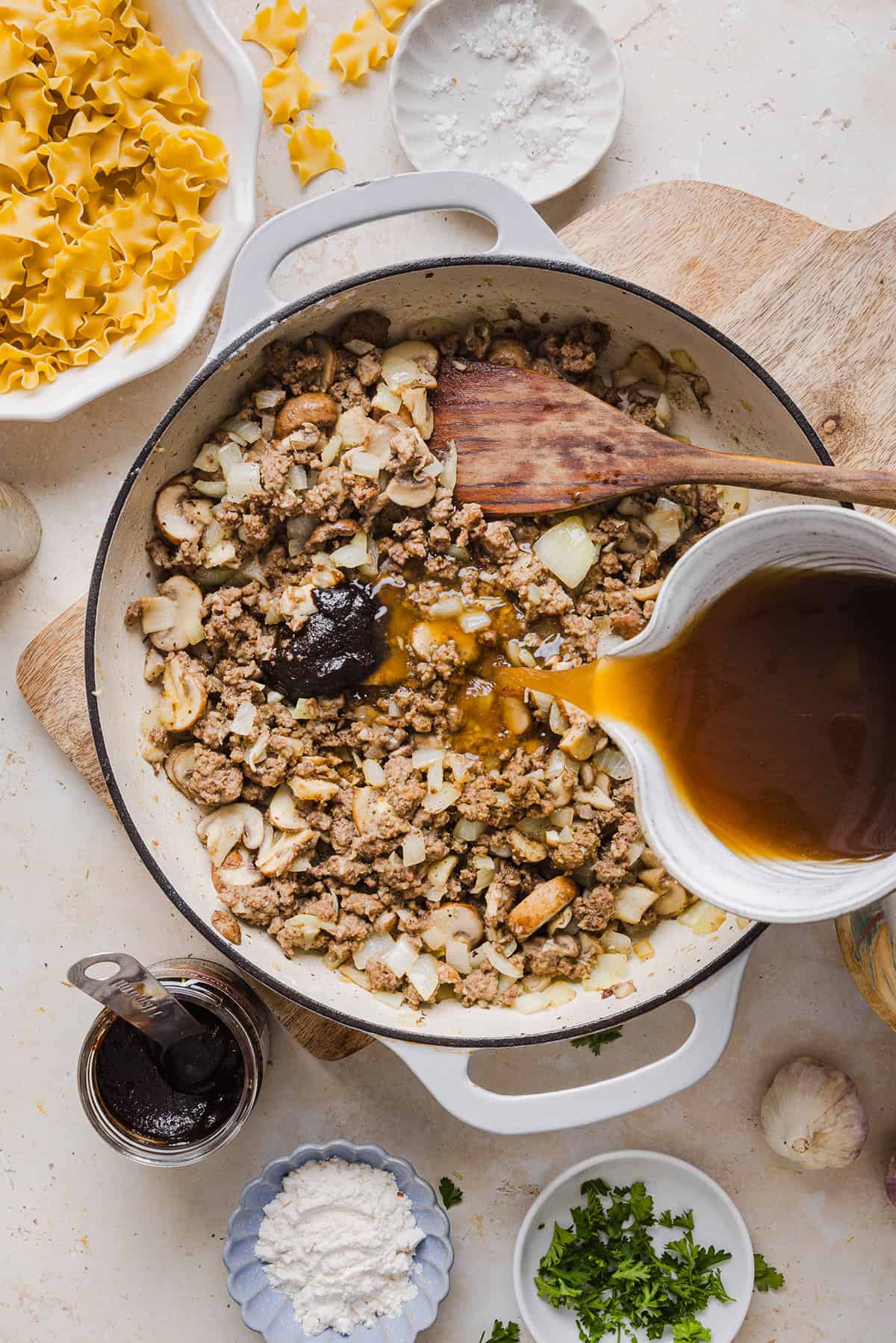 This Healthy Ground Beef Stroganoff Casserole is the ultimate family-friendly comfort food! The perfect cozy weeknight meal made with egg noodles and smothered in the most delicious creamy mushroom sauce in just 30 minutes!