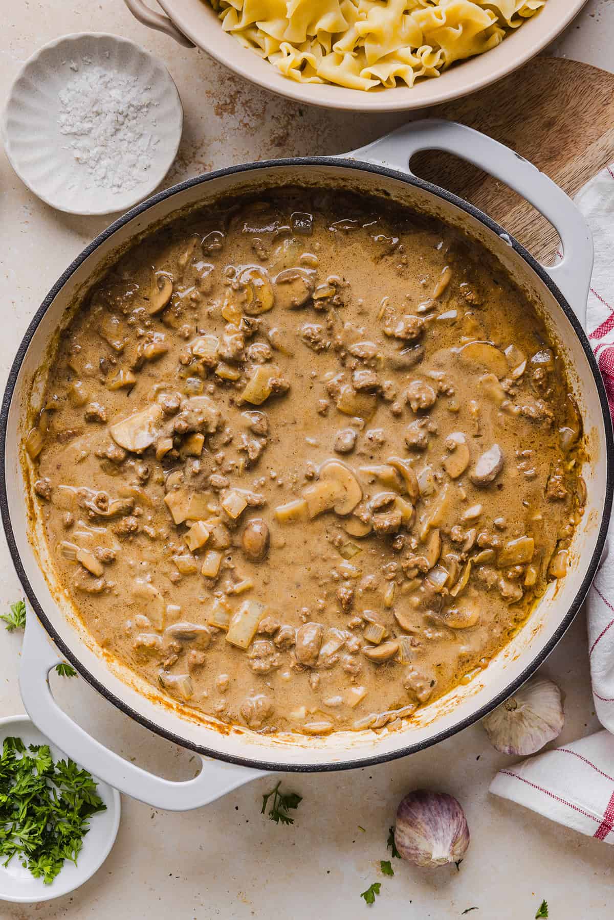 This Healthy Ground Beef Stroganoff Casserole is the ultimate family-friendly comfort food! The perfect cozy weeknight meal made with egg noodles and smothered in the most delicious creamy mushroom sauce in just 30 minutes!