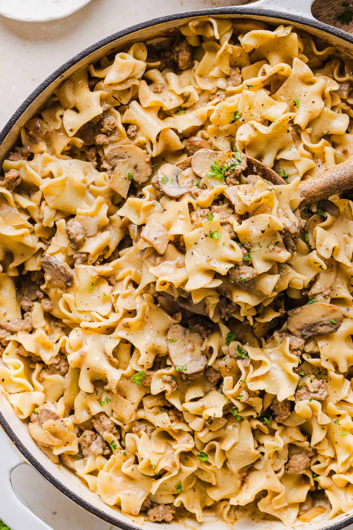 This Healthy Ground Beef Stroganoff Casserole is the ultimate family-friendly comfort food! The perfect cozy weeknight meal made with egg noodles and smothered in the most delicious creamy mushroom sauce in just 30 minutes!