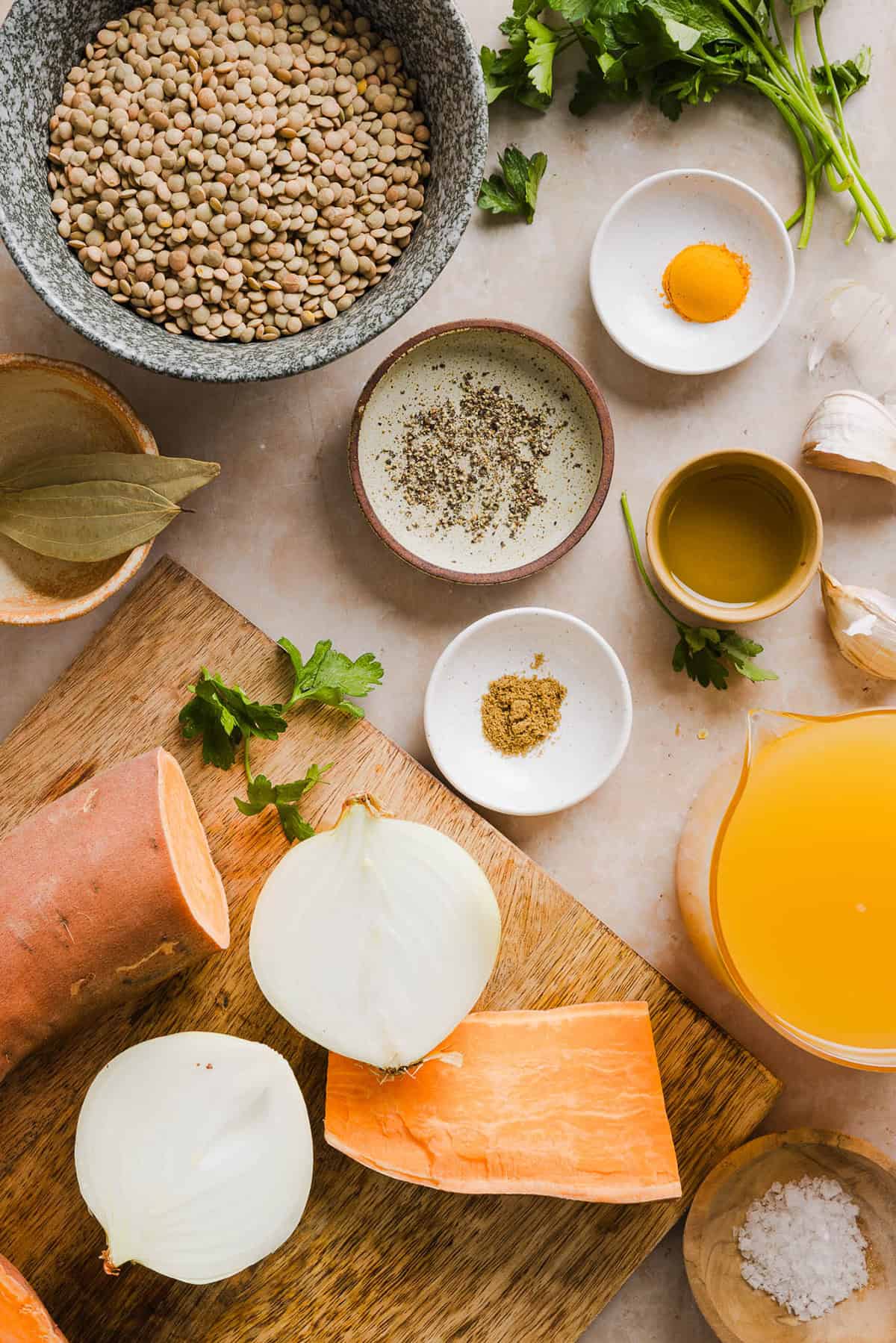 This hearty Lentil and Sweet Potato Stew is is delicious, super filling and easily comes together in under 30 minutes for the perfect weeknight dinner! A nourishing meal made with pantry staples that is gluten-free, dairy-free and vegan.