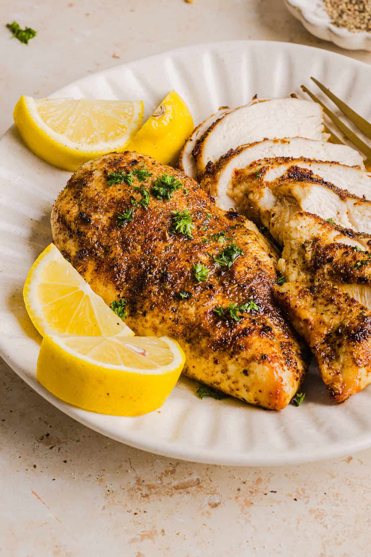 Juicy Air Fryer Chicken Breast recipe that comes out perfectly every time in just 20 minutes! Seasoned with a blend of herbs and spices for a delicious, healthy meal great for busy weeknights or when you need to meal prep.