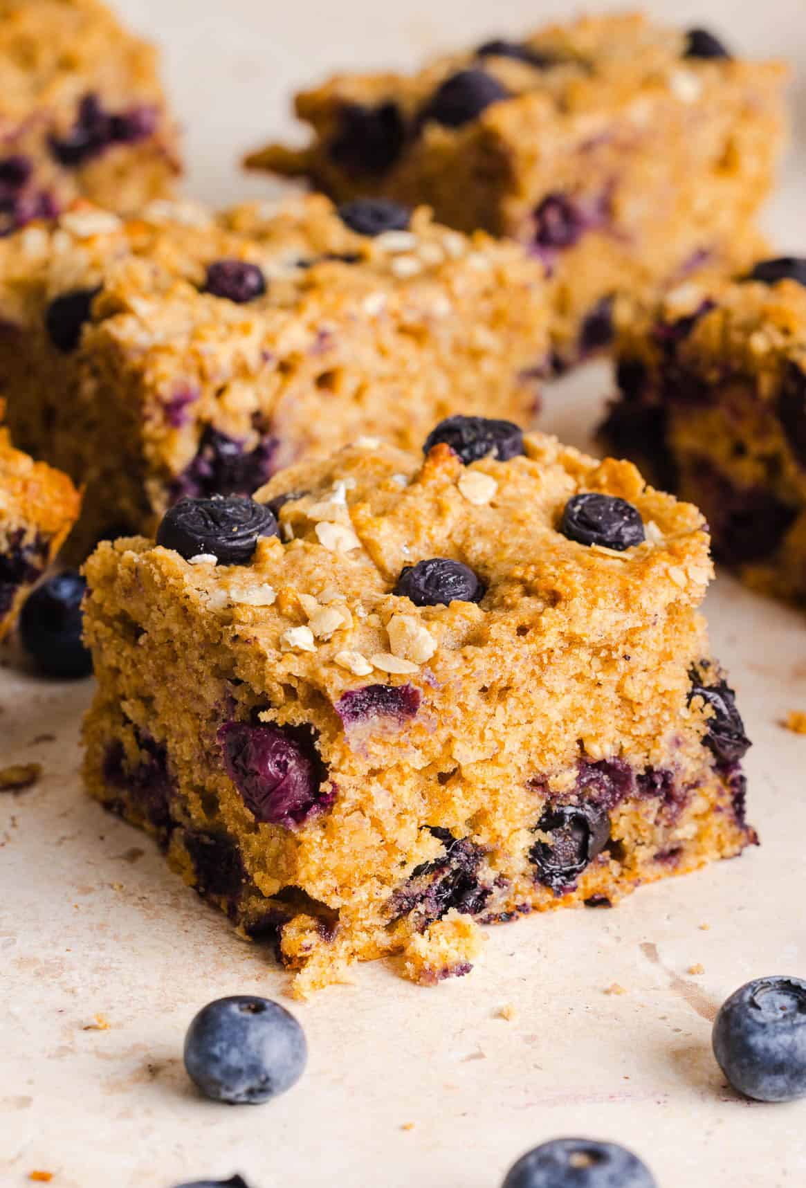 These Healthy Blueberry Oatmeal Breakfast Bars are easily made with wholesome oats, Greek yogurt, and fresh blueberries for the perfect morning breakfast or meal prep snack!
