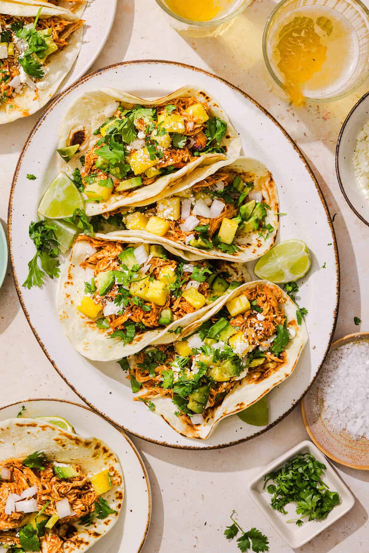 These Crock Pot Chicken Al Pastor Tacos are sweet, smoky, and incredibly flavorful! An easy slow cooker dinner made with juicy shredded chicken, fresh pineapple, chipotle peppers, and warm spices for a healthy, protein-packed dinner.