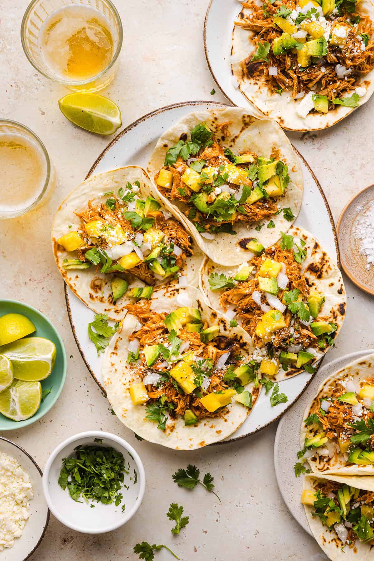 These Crock Pot Chicken Al Pastor Tacos are sweet, smoky, and incredibly flavorful! An easy slow cooker dinner made with juicy shredded chicken, fresh pineapple, chipotle peppers, and warm spices for a healthy, protein-packed dinner.