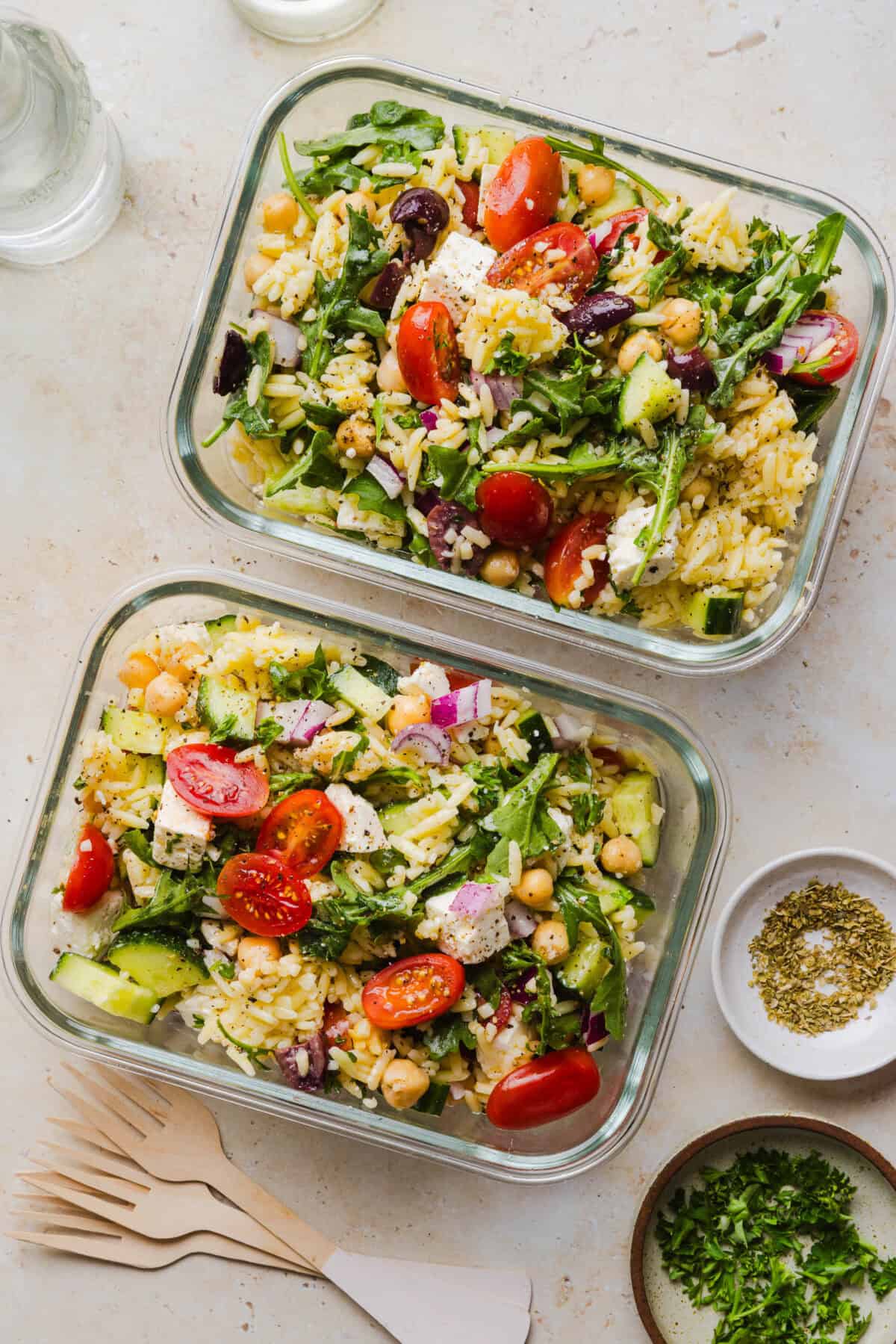 This Easy Greek Orzo Salad is packed with fresh veggies, chickpeas, feta, and the most delicious homemade lemon herb dressing. Perfect for meal prep, picnics, and summer cookouts!
