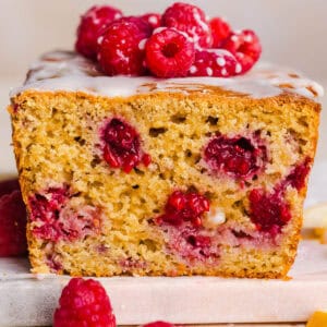 Make the BEST Raspberry Lemon Yogurt Bread with fresh raspberries, protein-packed Greek yogurt, and bright lemon flavor. This moist, wholesome quick bread is perfect for breakfast, brunch or dessert!