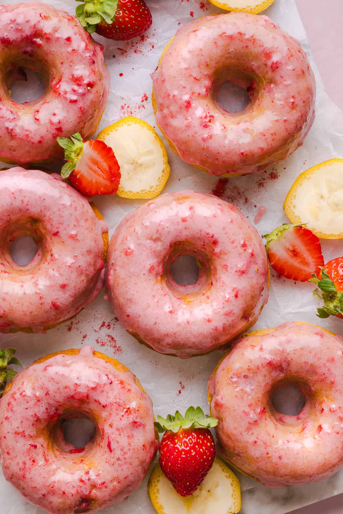 These Gluten-Free Strawberry Banana Donuts are soft, fluffy, and naturally sweetened with ripe bananas and fresh strawberries. These donuts are baked, not fried, and topped with a sweet strawberry glaze!