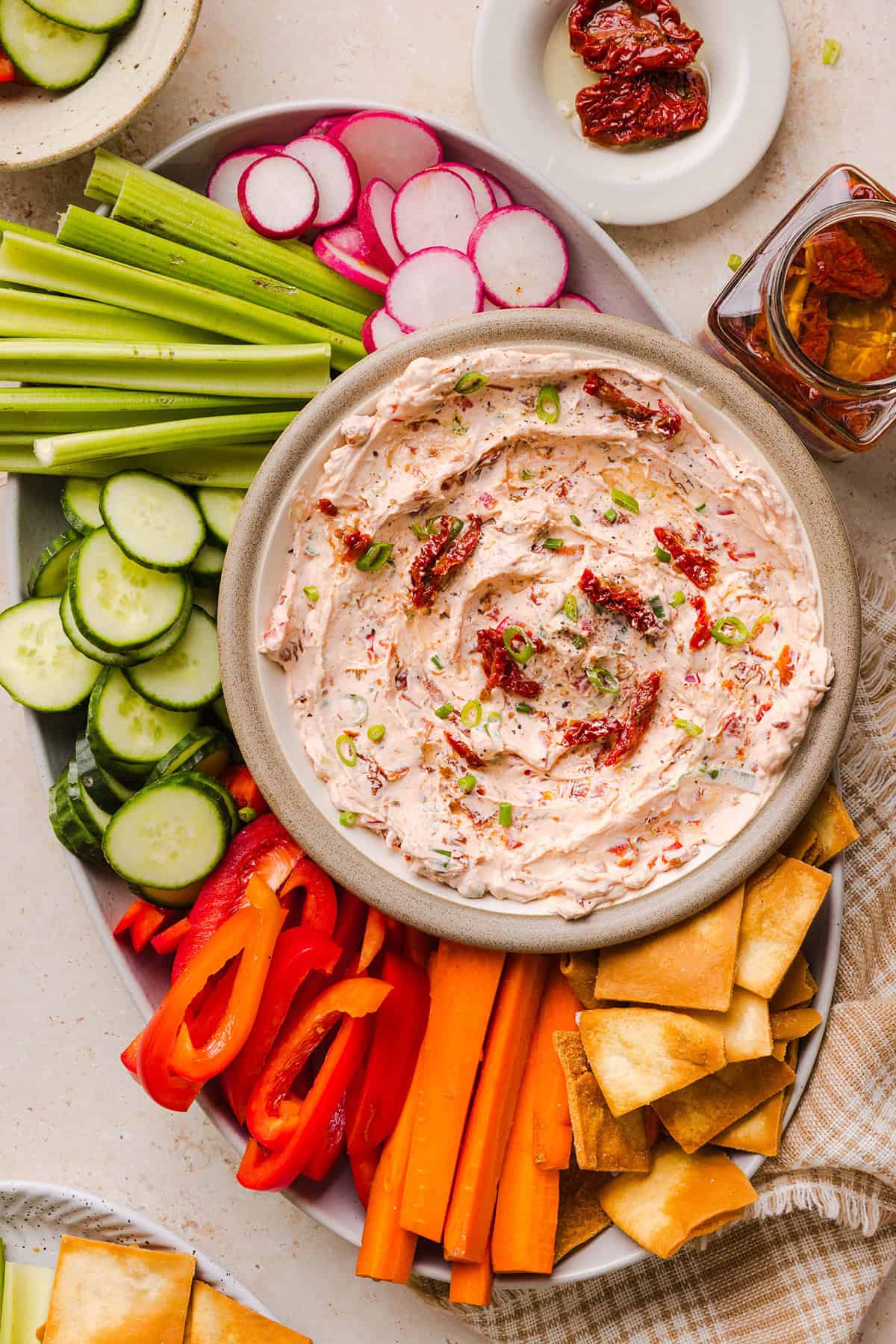 The BEST Creamy Sun-Dried Tomato Dip recipe made with protein-packed Greek yogurt, cream cheese, garlic, and bell peppers. Easy to make, perfect for parties, and ready in just minutes!