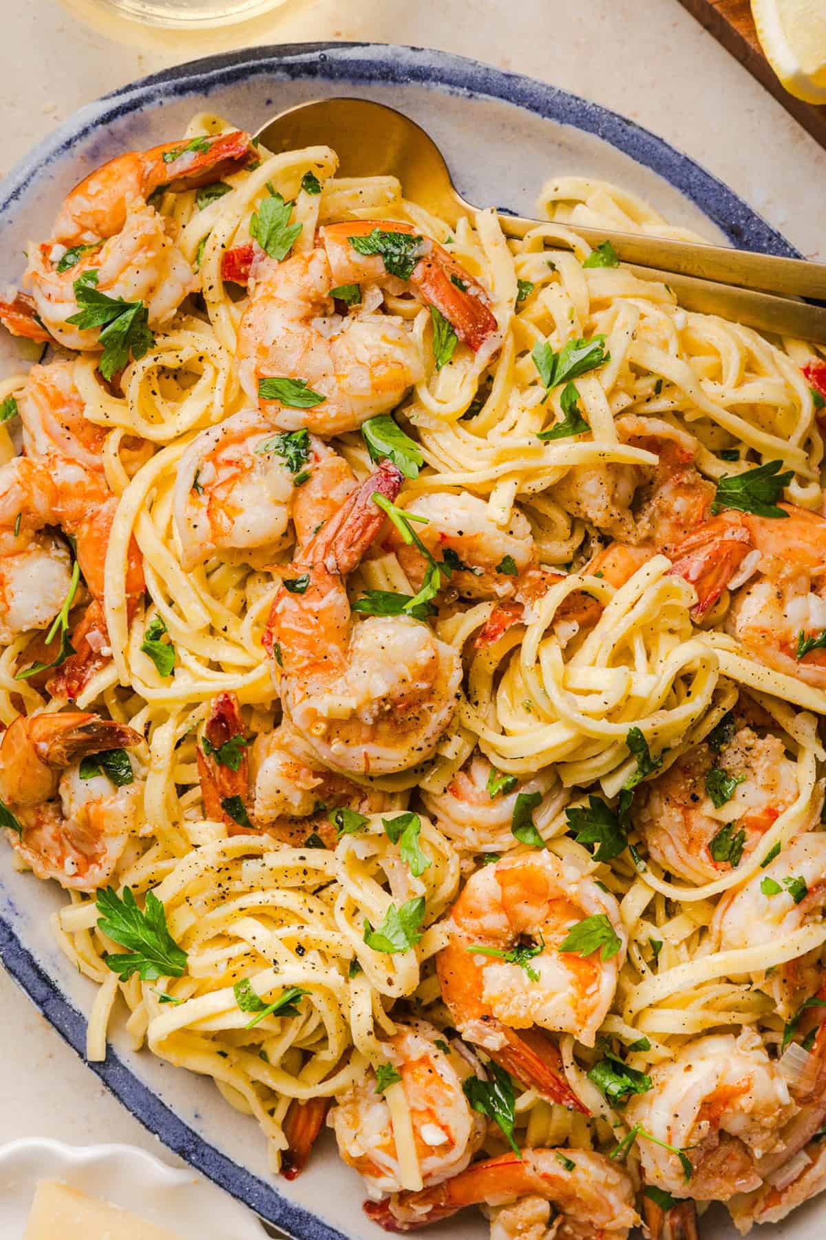 The BEST Healthy Shrimp Scampi recipe lightened up without sacrificing flavor! Juicy shrimp, garlic, lemon, white wine, and Parmesan are tossed with tender linguine in a silky, buttery sauce that’s ready in just 30 minutes.