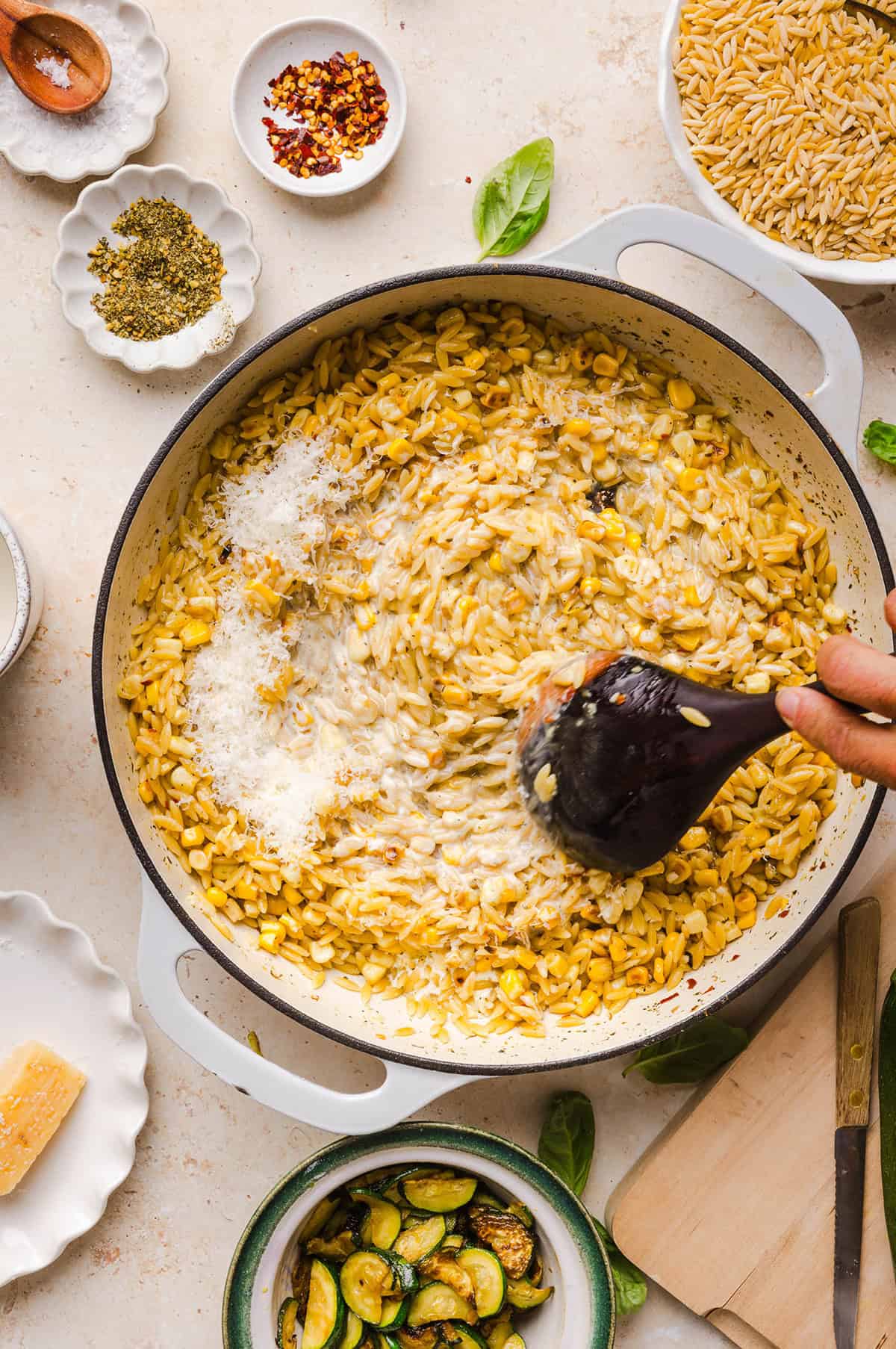 This creamy One Pan Lemon Garlic Orzo with Zucchini and Corn is fresh, flavorful and made in one skillet for an easy summer side dish or weeknight meal. Packed with fresh veggies, tender orzo, Parmesan, herbs and bright lemon flavor!